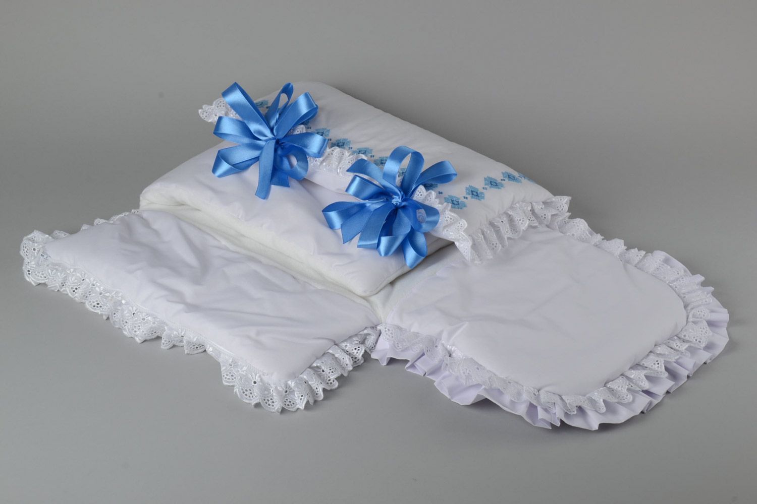 Handmade newborn blanket sewn of cotton with embroidery and blue ribbons photo 4