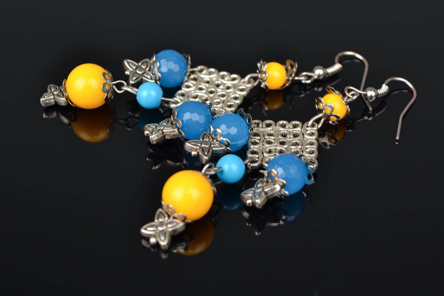 Massive metal earrings with beads photo 1