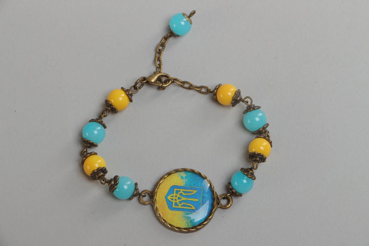 Handmade blue and yellow bright glass glaze wrist bracelet in Ukrainian style photo 2