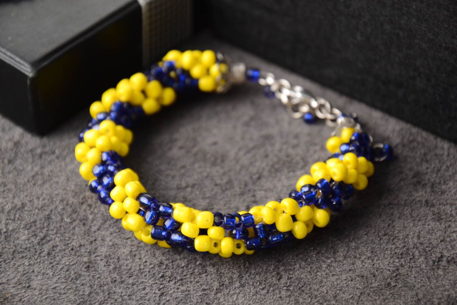 Cord beaded elegant bracelet in yellow and dark blue color photo 1
