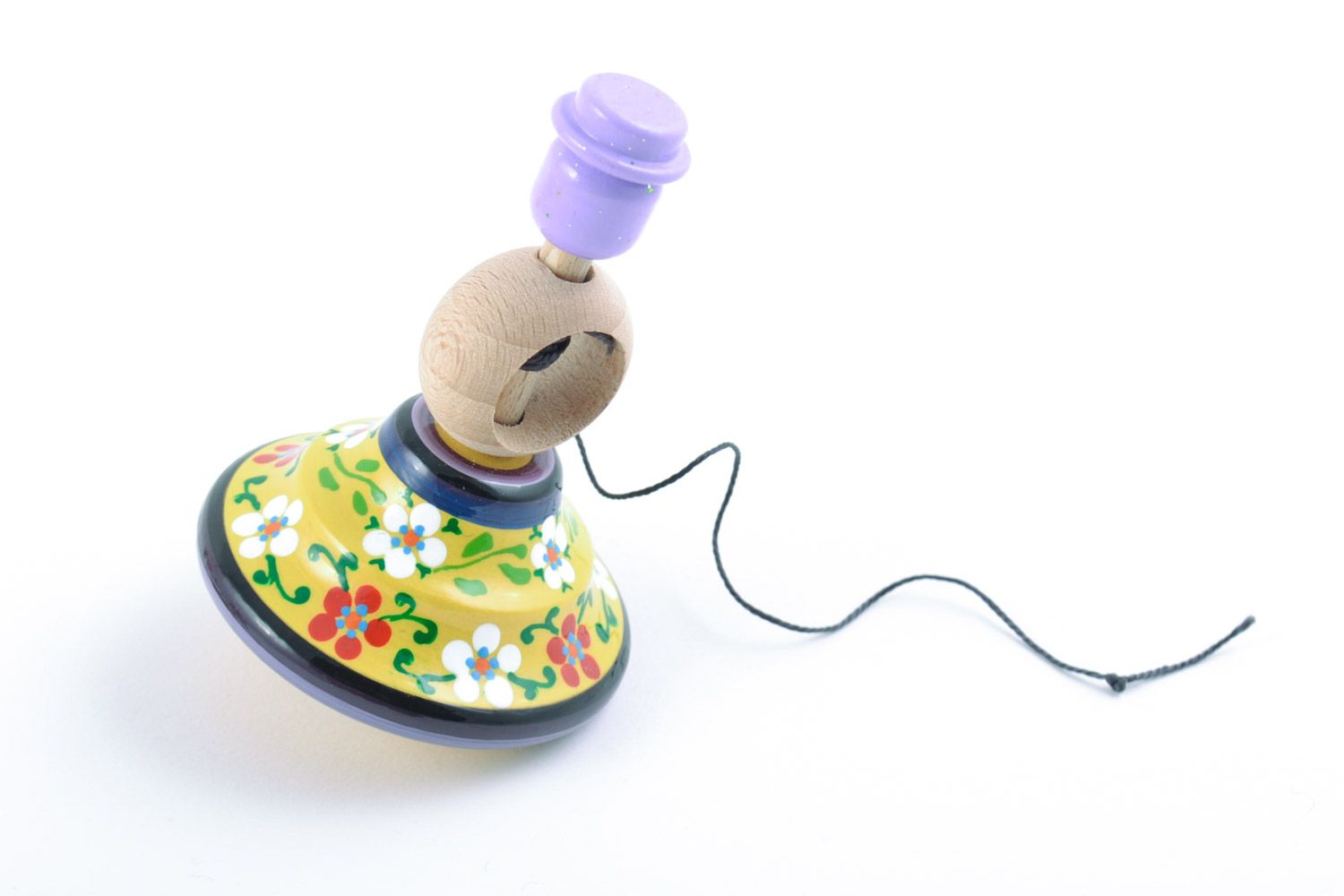 Small decorative painted wooden homemade toy spinning top with floral ornaments photo 5