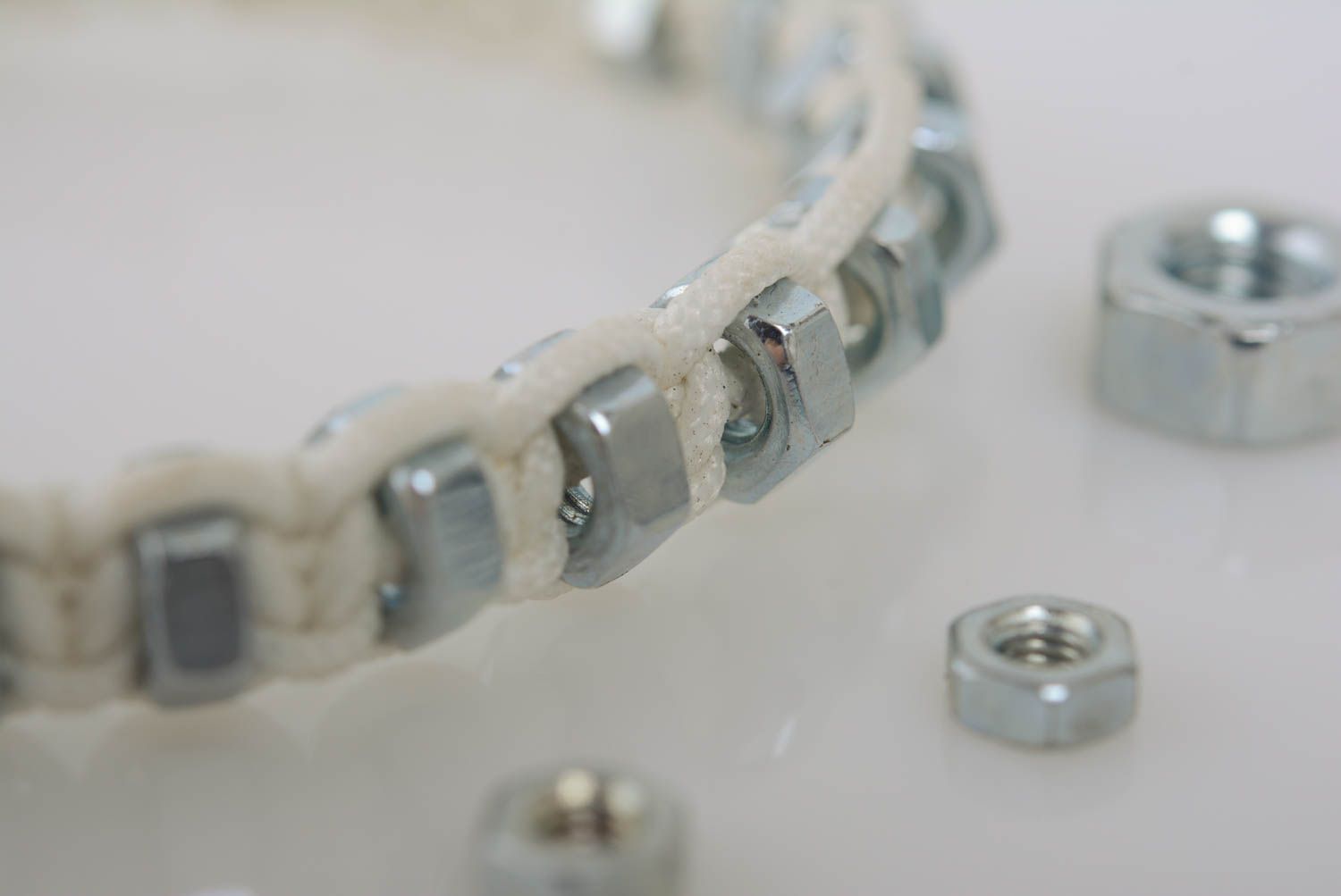 White handmade designer thin macrame woven cord bracelet with nuts photo 2