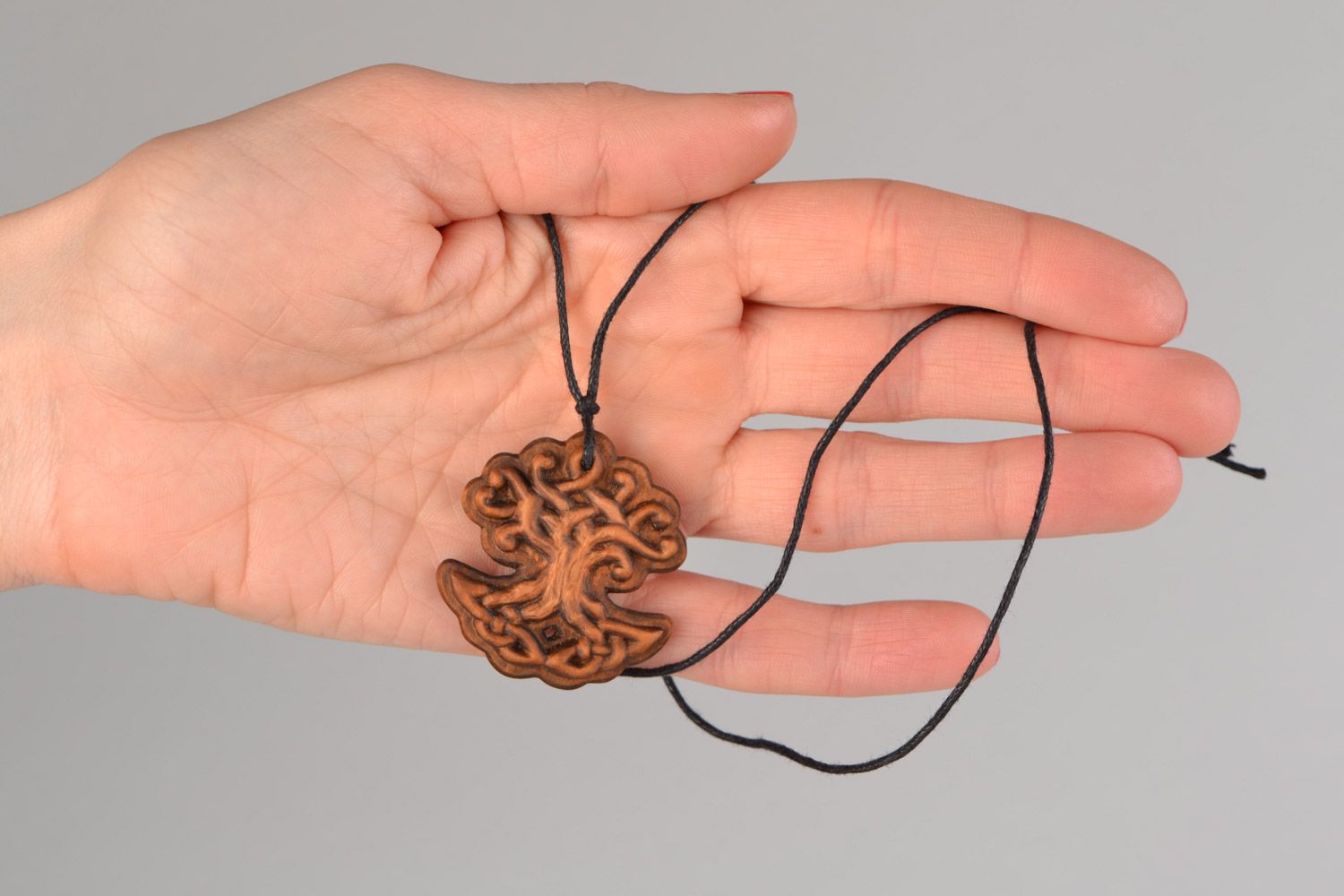 Handmade carved wooden pendant of unusual shape on waxed cord unisex photo 2