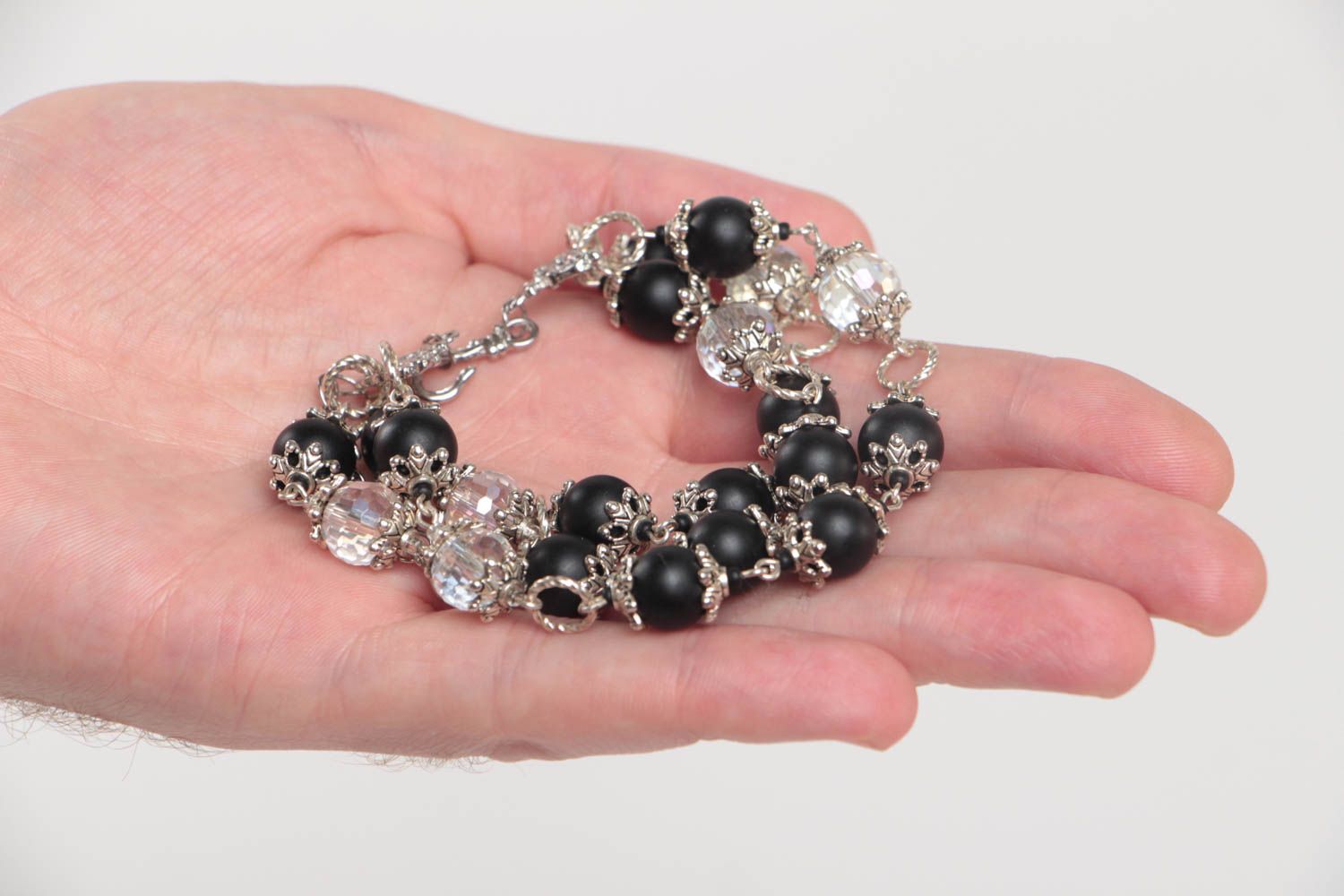 Three-layer beaded gemstone bracelet with black beads and metal charms photo 5