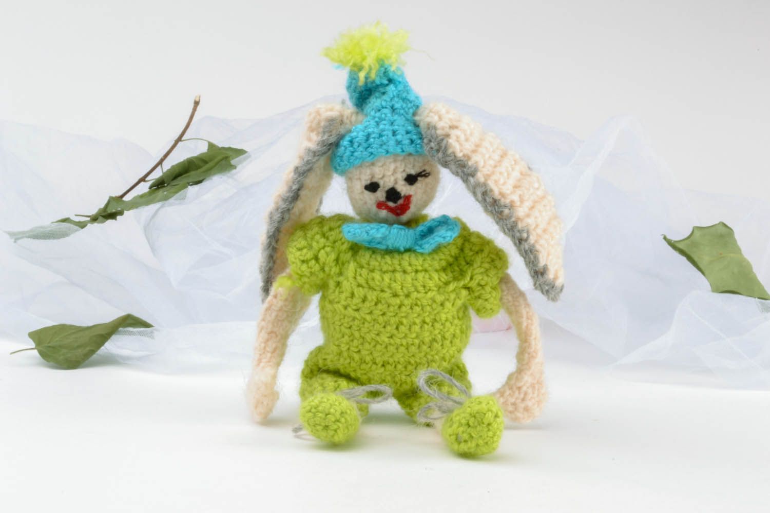 Soft toy hare in green photo 1
