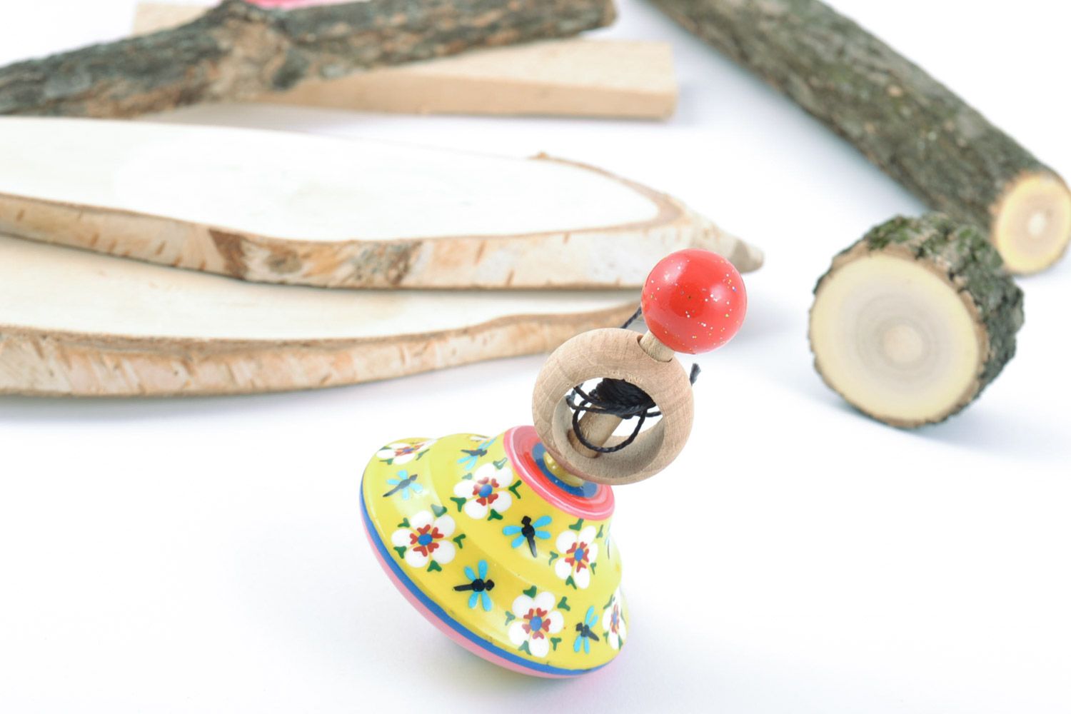 Painted handmade wooden spinning top toy for motor development present for baby photo 1