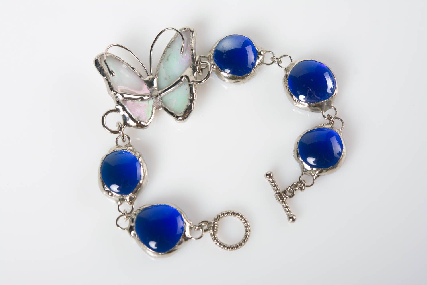 Handmade designer metal wrist bracelet with blue glass and butterfly photo 1