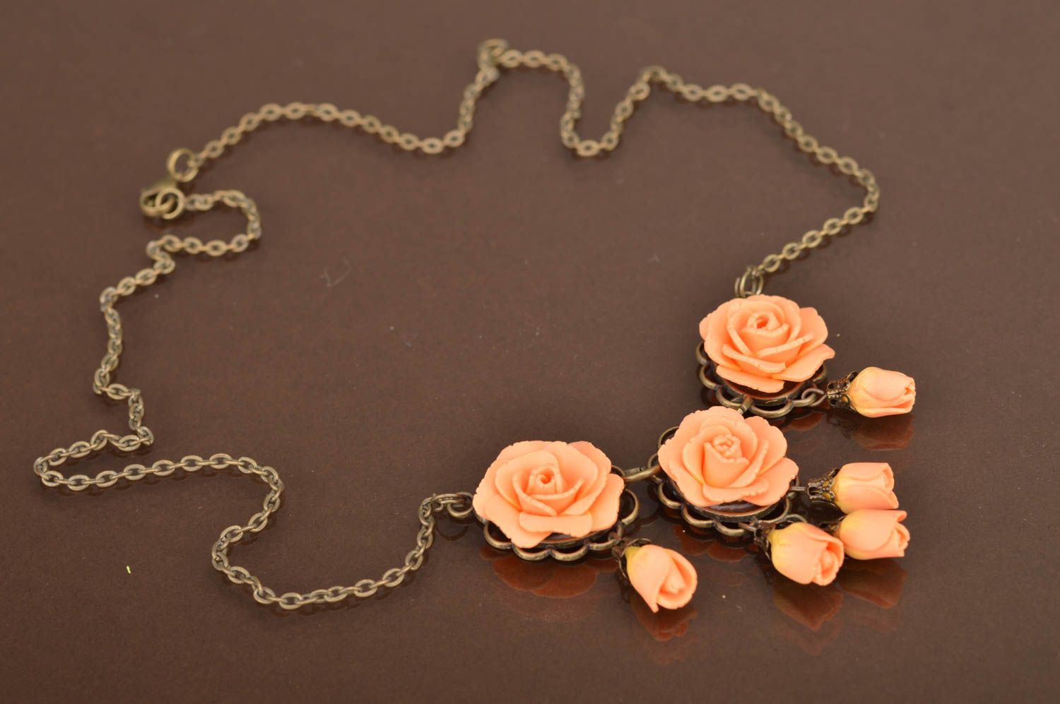 Handmade cute pendant made of polymer clay on chain with peach flowers photo 2