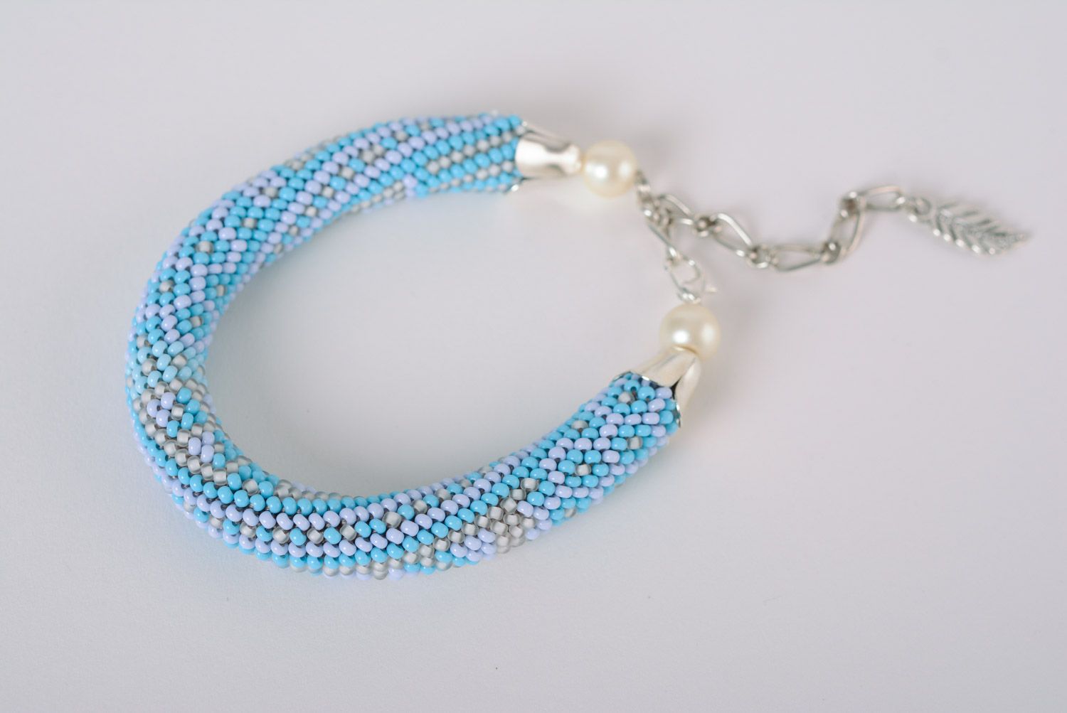 Blue handmade woven beaded cord bracelet with chain and pearl-like beads photo 1