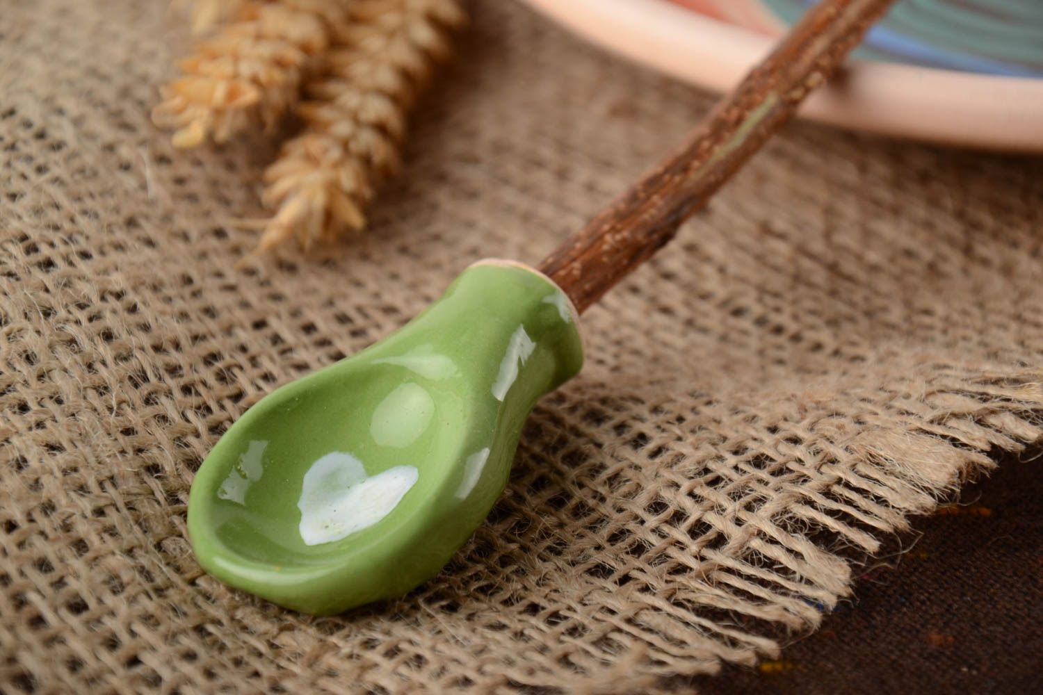 Glazed green handmade designer clay spoon with apricot branch handle photo 1
