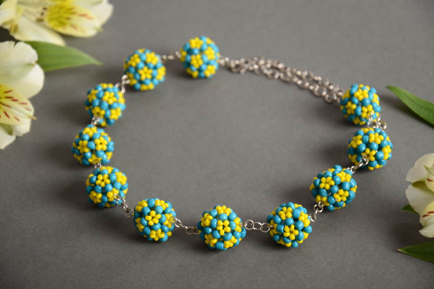 Handmade designer necklace with metal chain and bead woven blue and yellow balls photo 1