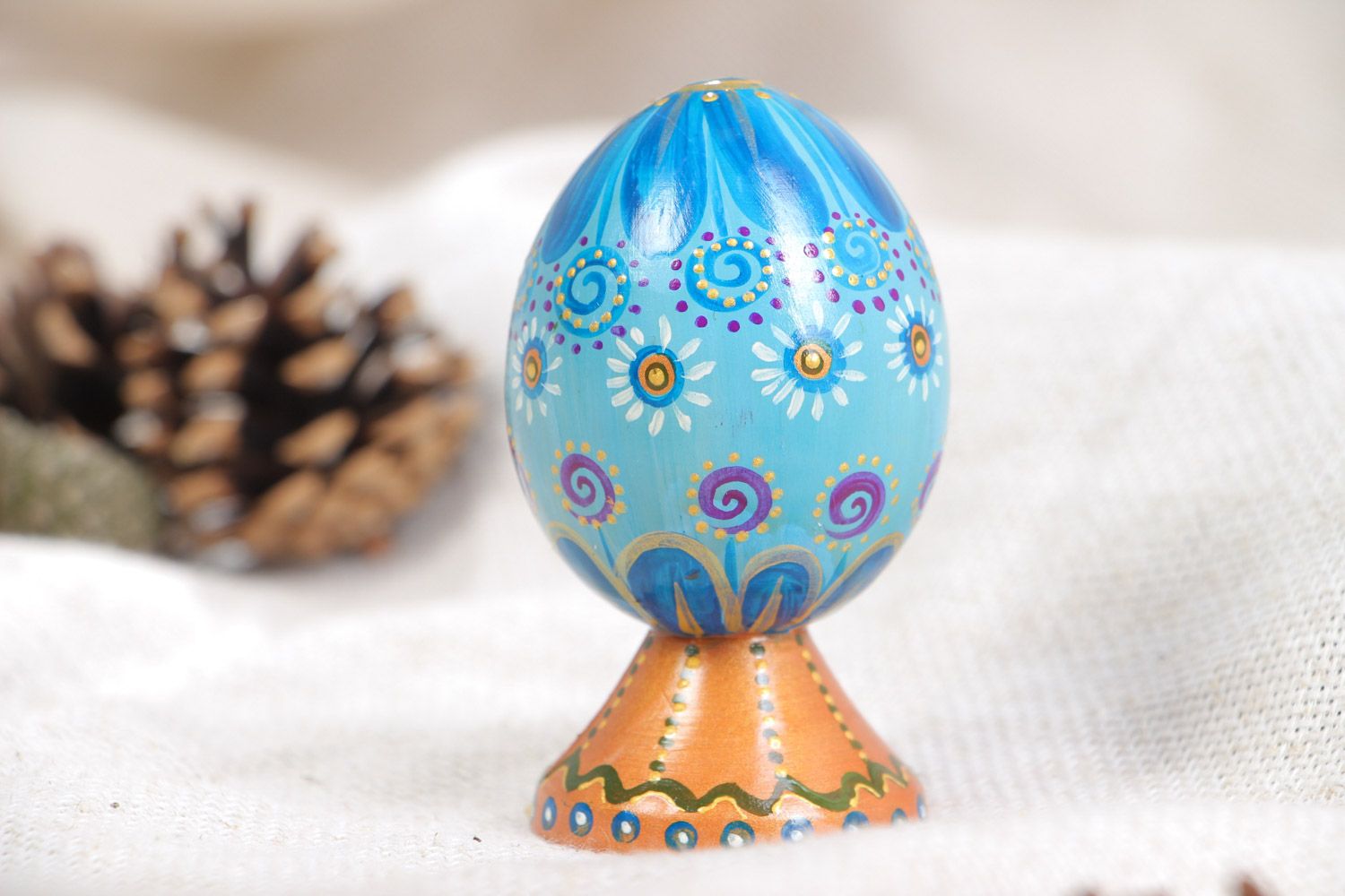Handmade decorative blue painted wooden egg on stand for Easter decoration photo 1