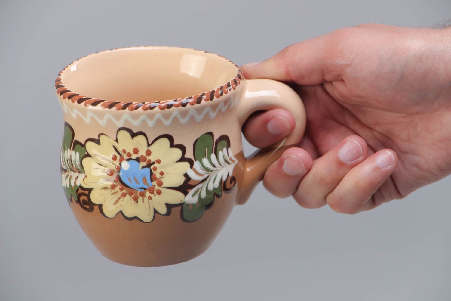 10 oz clay glazed cup with handle and floral design in brown, beige, and blue color photo 5