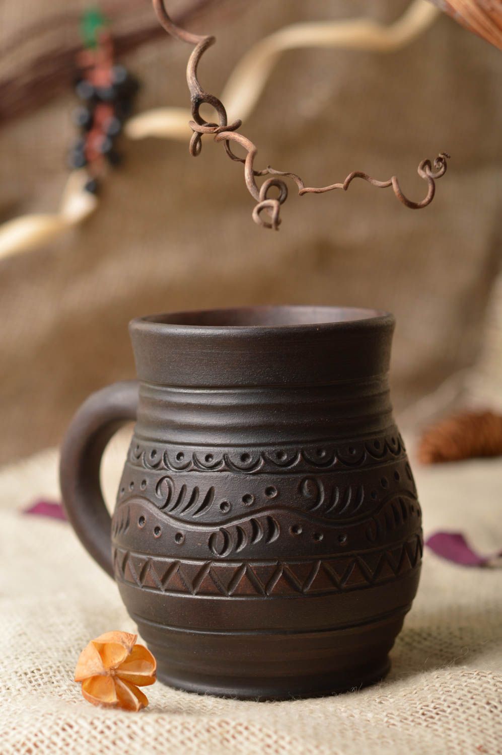 8 oz clay dark brown clay coffee cup with handle and village-style pattern photo 1