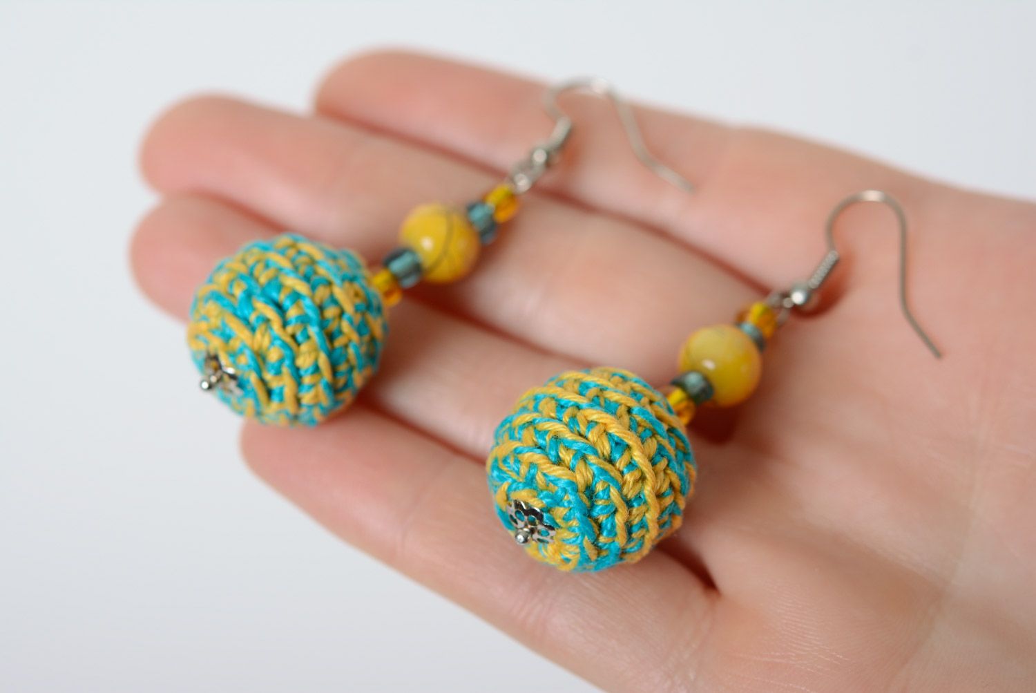 Handmade beaded earrings crocheted over with yellow and blue cotton threads photo 5