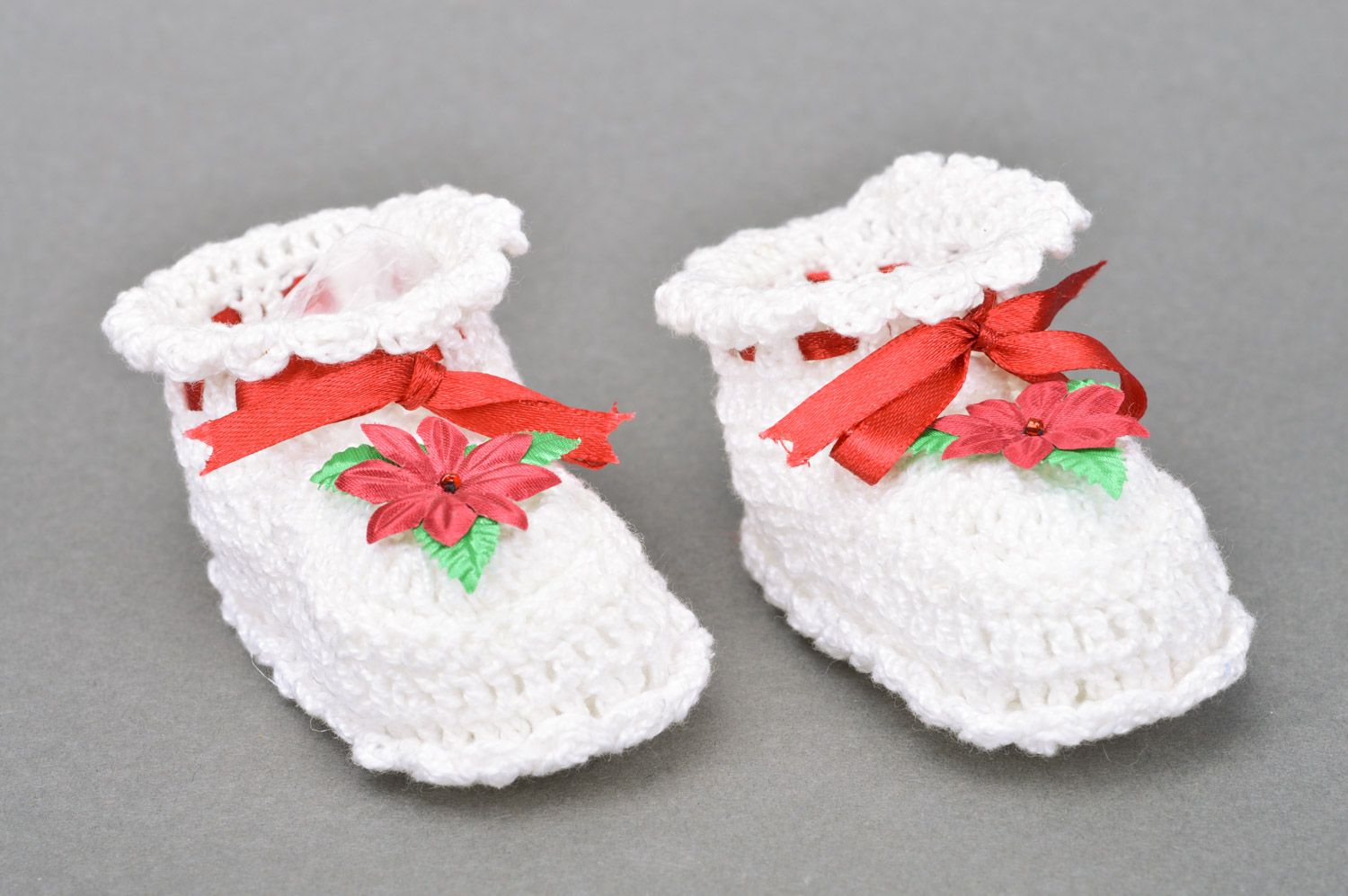 Handmade crocheted white baby booties made of cotton with a flower for a baby girl photo 2