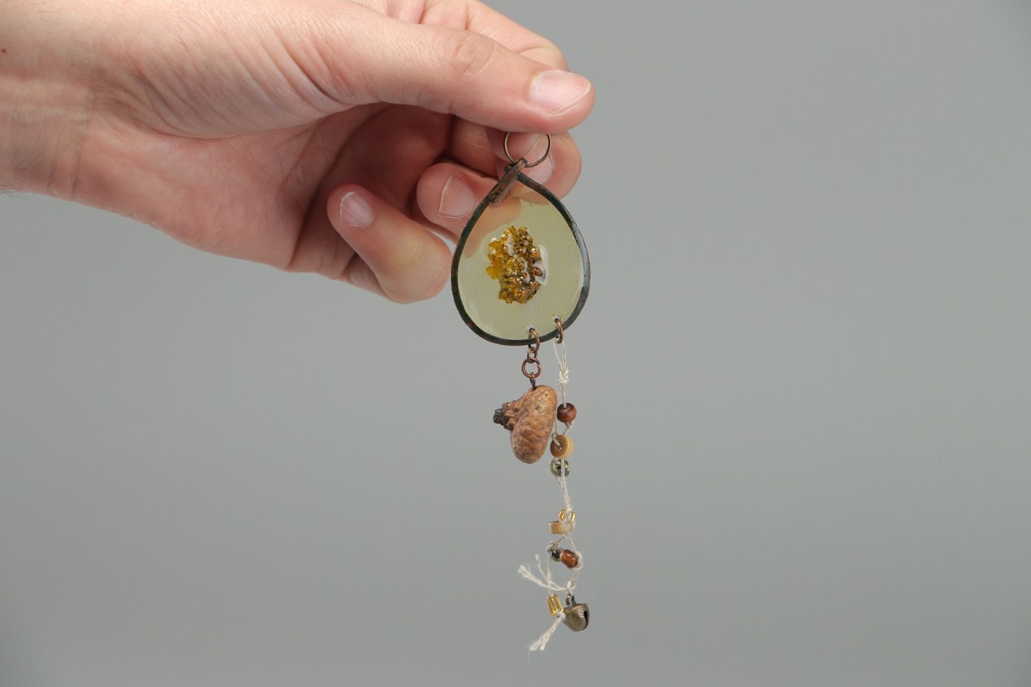 Handmade neck pendant with bark and acorn hat embedded in epoxy resin  photo 4