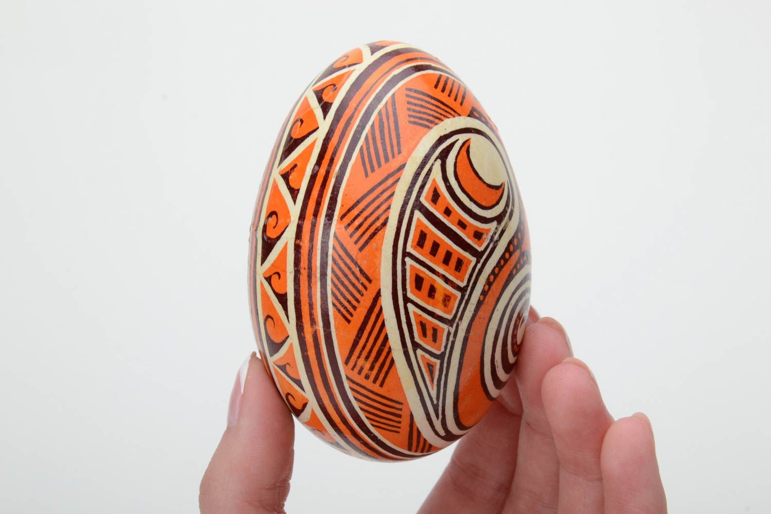 Unusual handmade orange painted Easter egg decorated using waxing technique photo 5