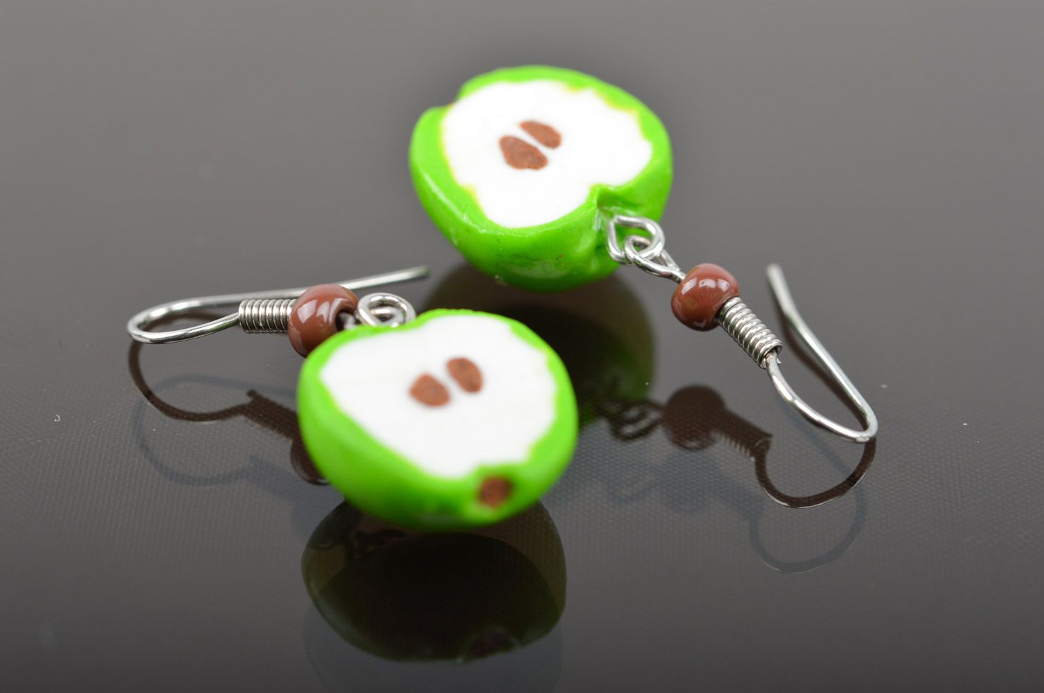 Bright lime and white handmade polymer clay earrings with charms in the shape of apple halves photo 5