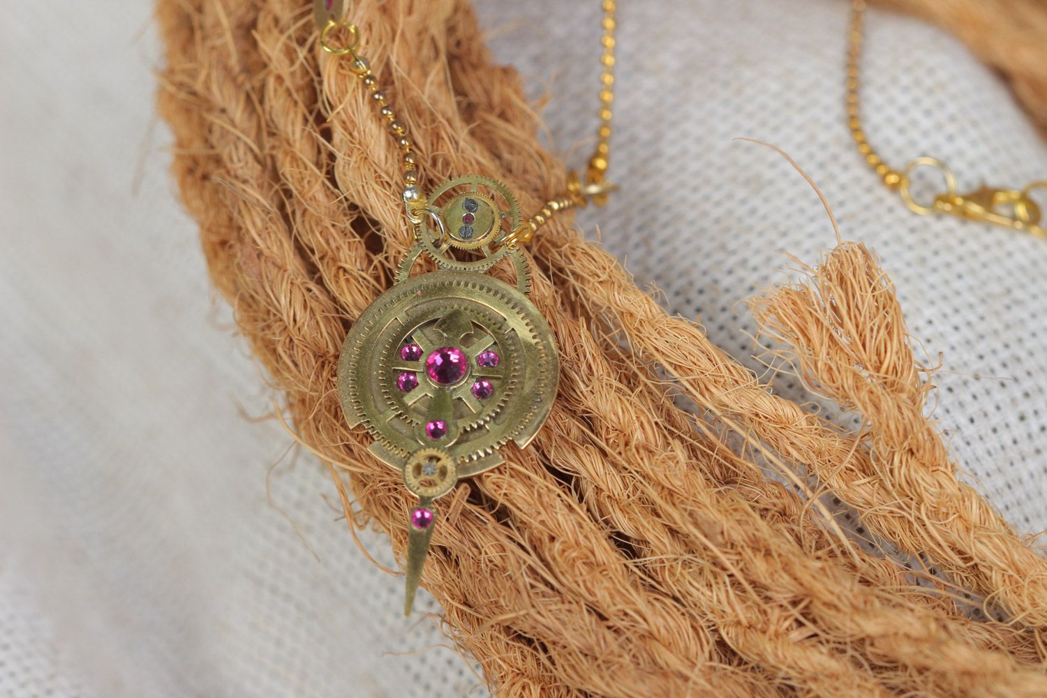 Handmade steampunk pendant with clockwork details and crystals on chain photo 1