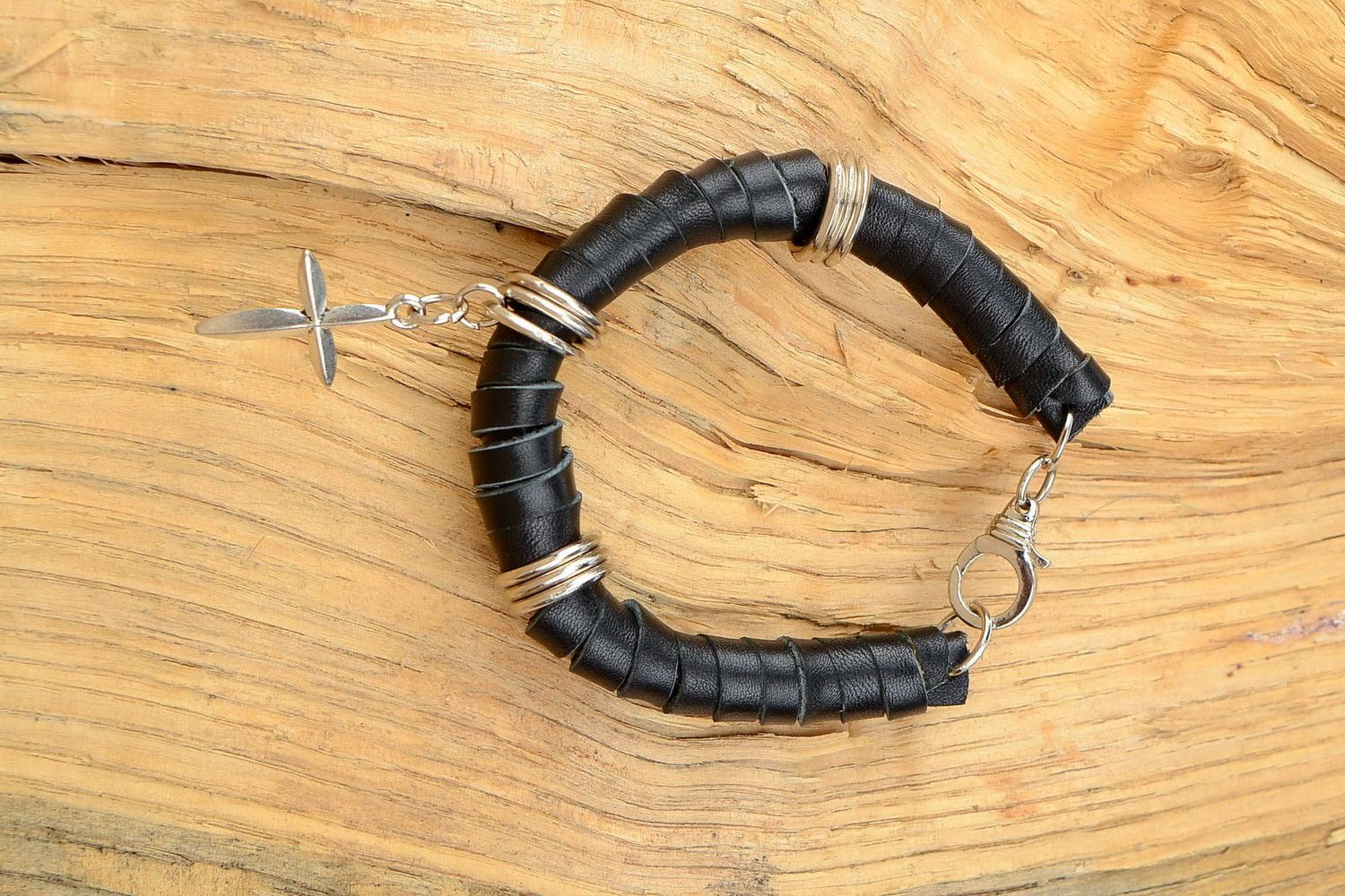 Leather bracelet with a cross photo 1