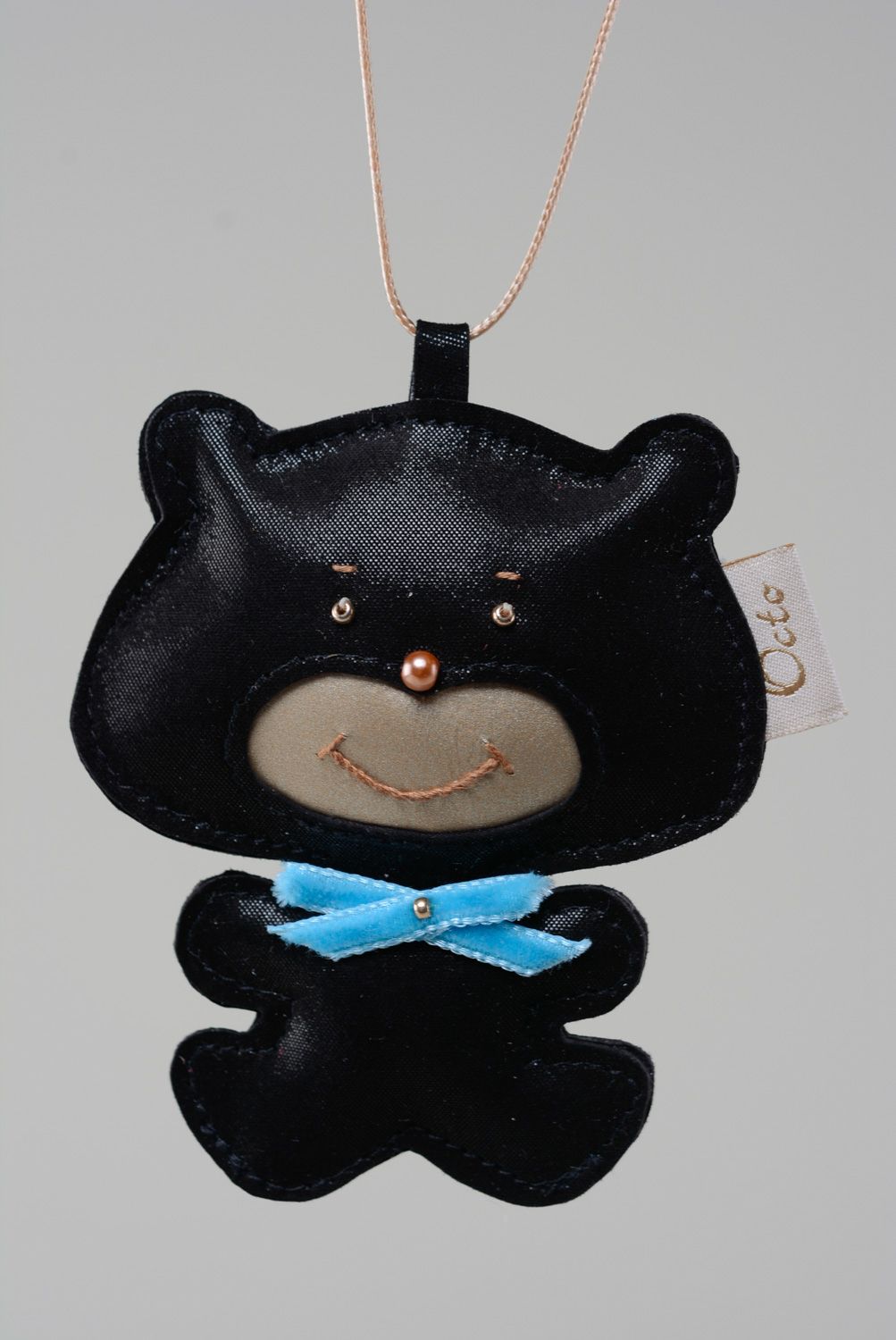 Handmade genuine leather keychain in the shape of black bear with blue bow  photo 1