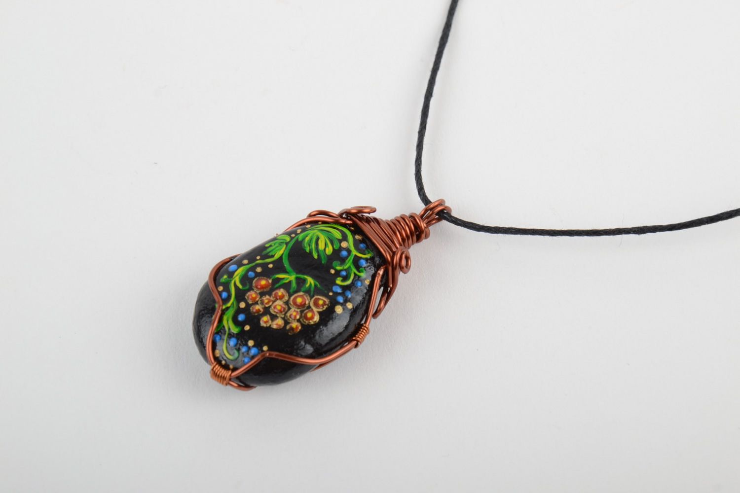 Unusual handmade plastic pendant woven over with copper wire and equipped with cord photo 2