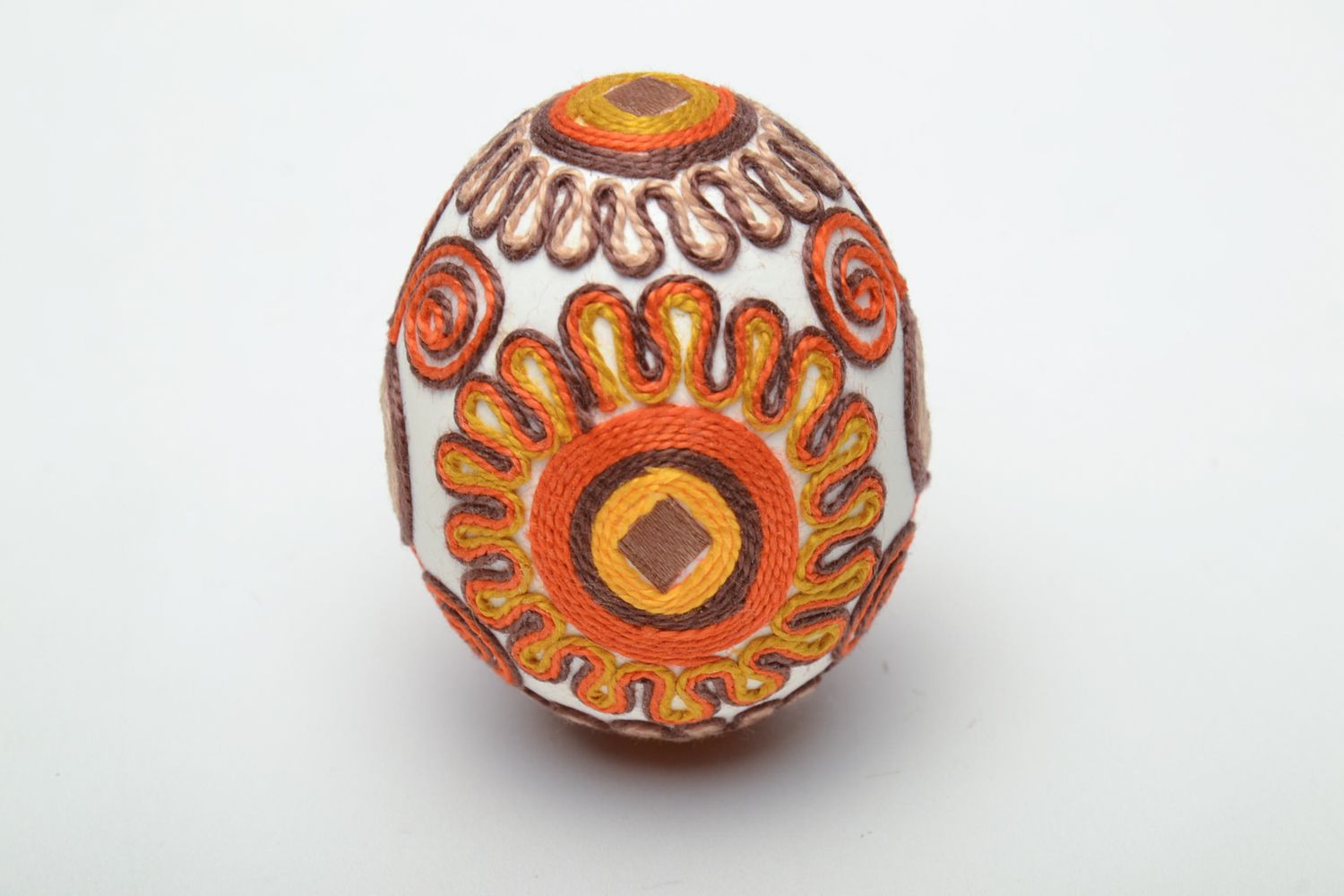 Unusual decorative Easter egg ornamented with threads photo 2