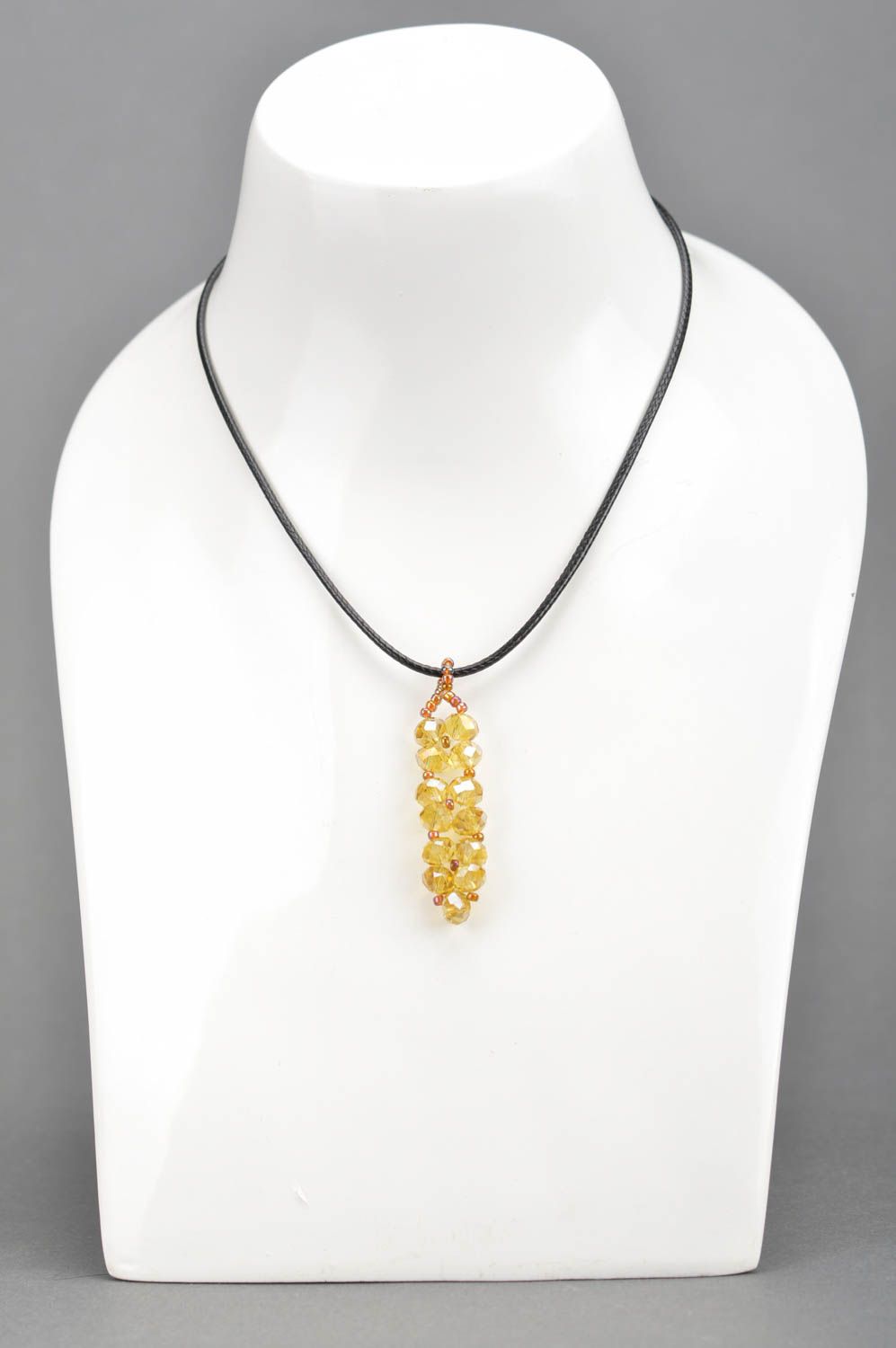Handmade yellow pendant made of large and seed beads of Czech crystal on lace photo 1