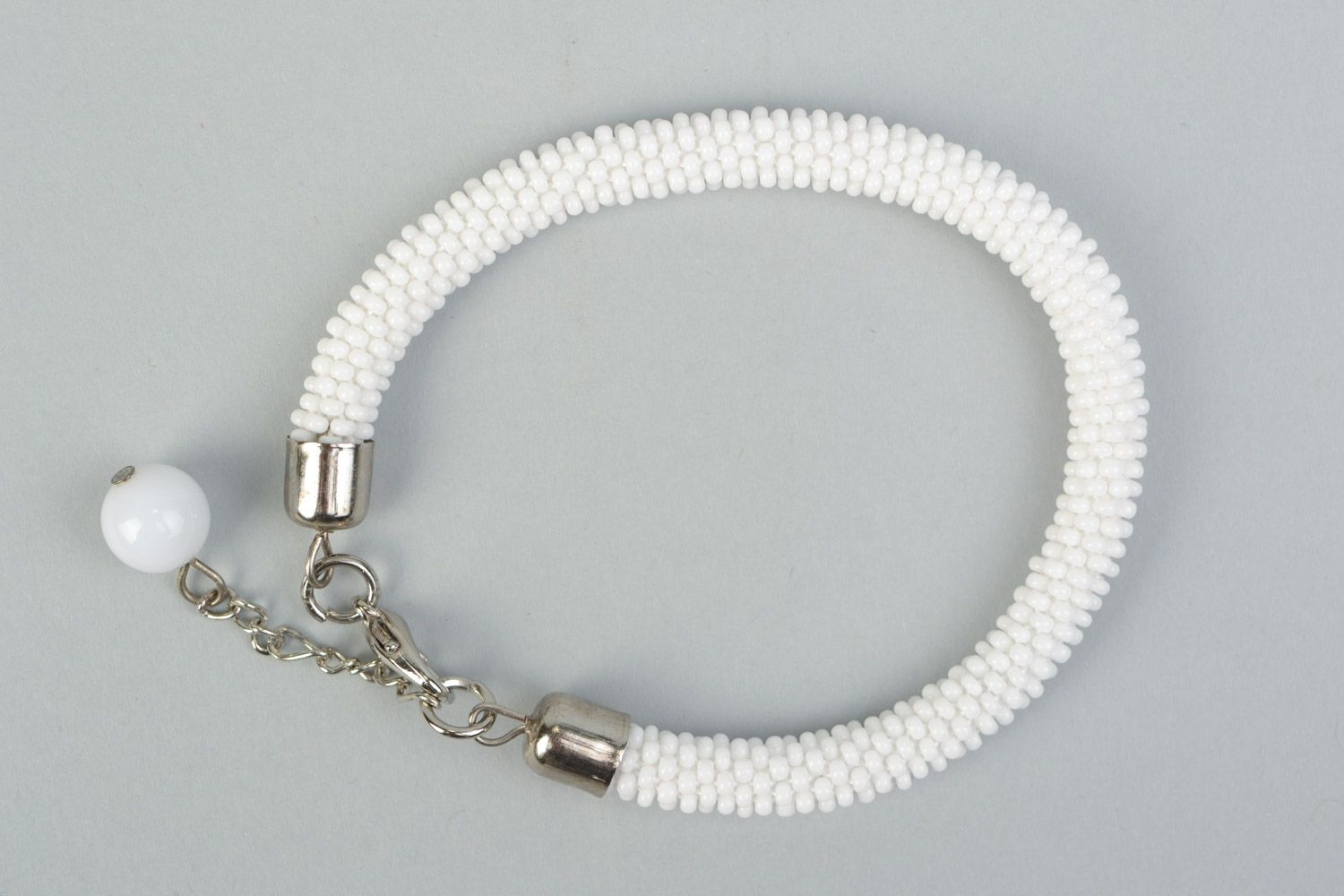 Handmade festive wrist cord bracelet crocheted of Czech beads in white color photo 2