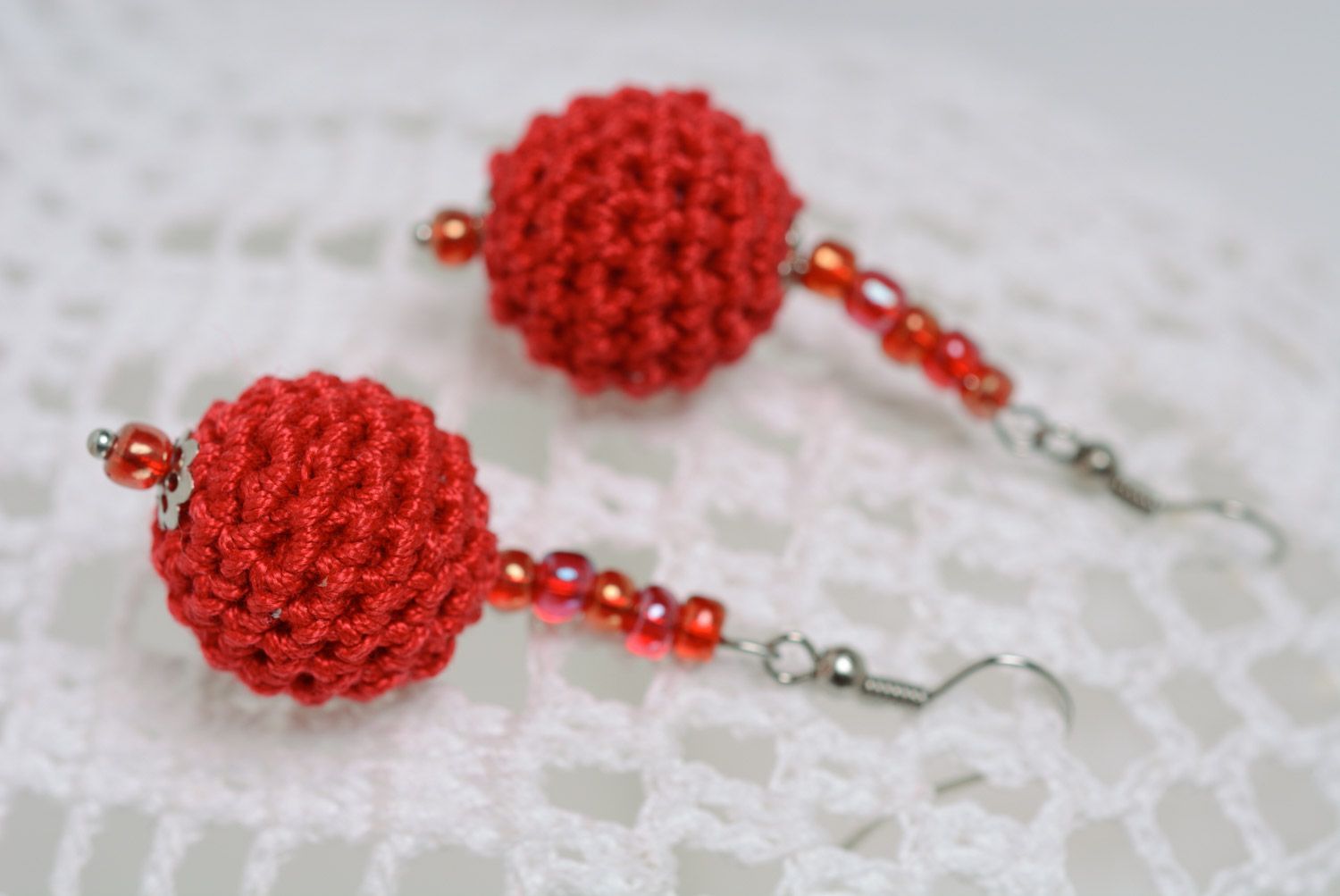 Handmade round dangle earrings with beads crocheted over with red cotton threads photo 1