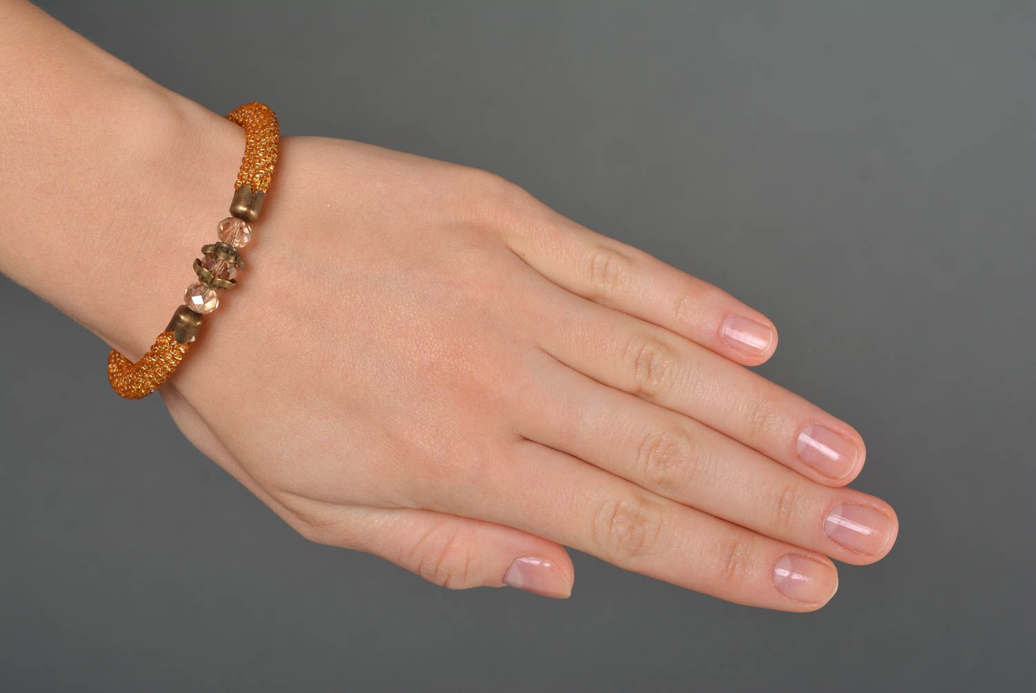 Handmade gold color beads cord bracelet with centerpiece transparent bead photo 2