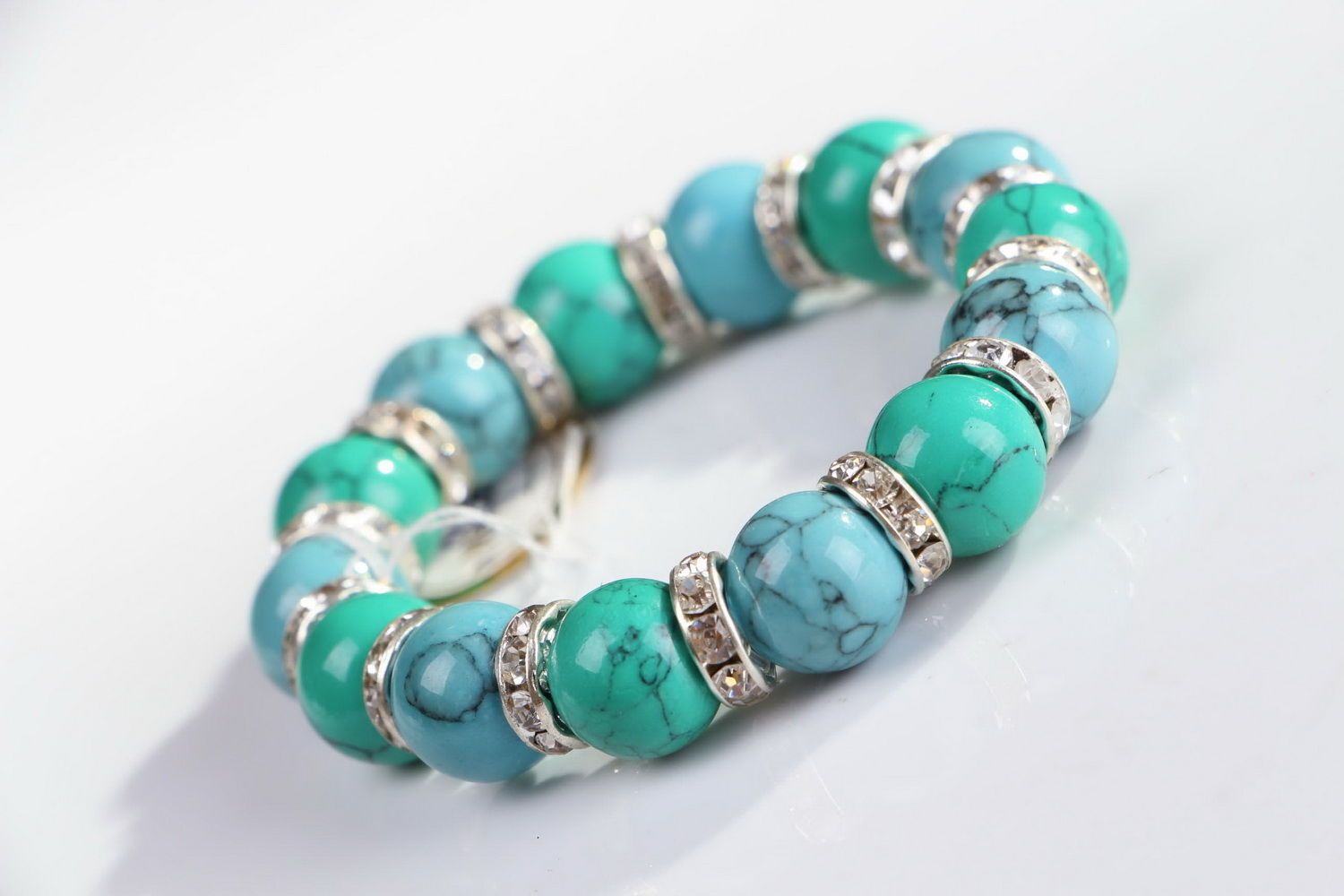 Bracelet with green and blue turquoise on elastic band photo 1