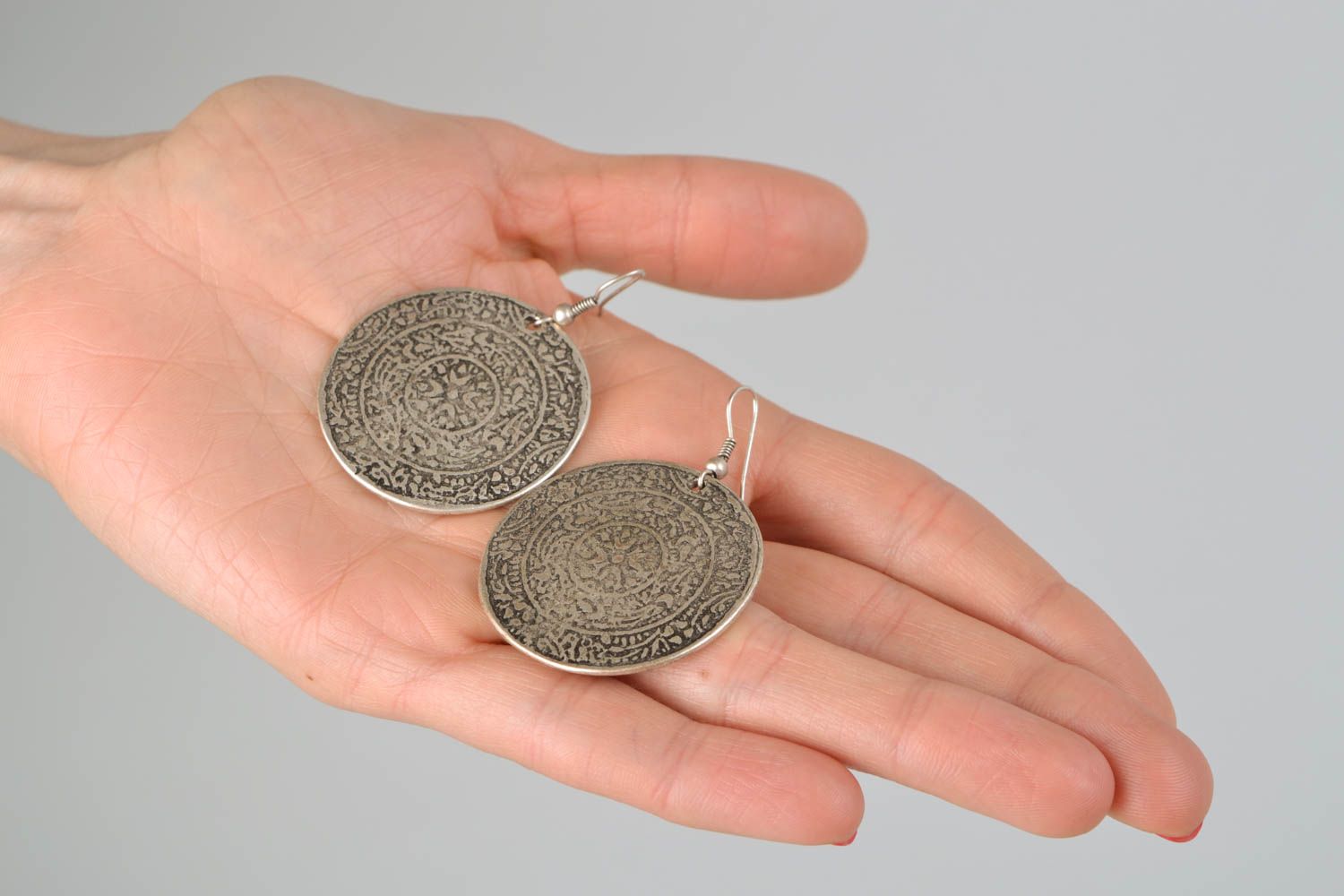 Round metal earrings with ethnic pattern photo 2