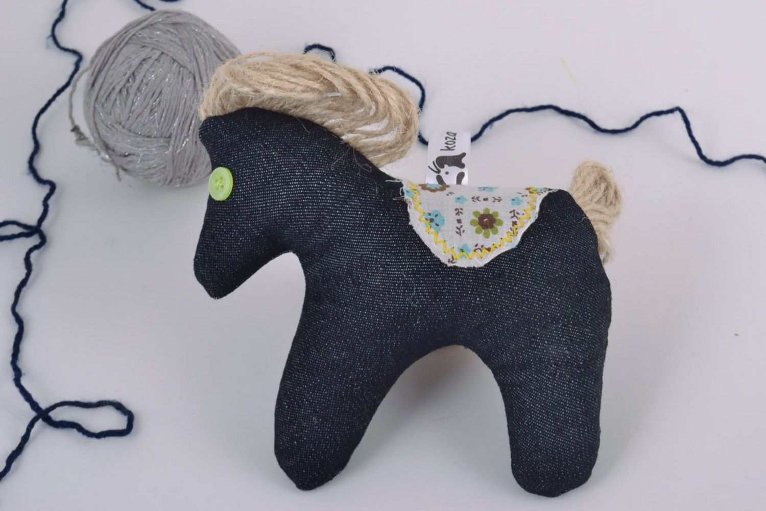 Handmade small soft toy sewn of dark blue fabric with embroidery and cord horse  photo 1