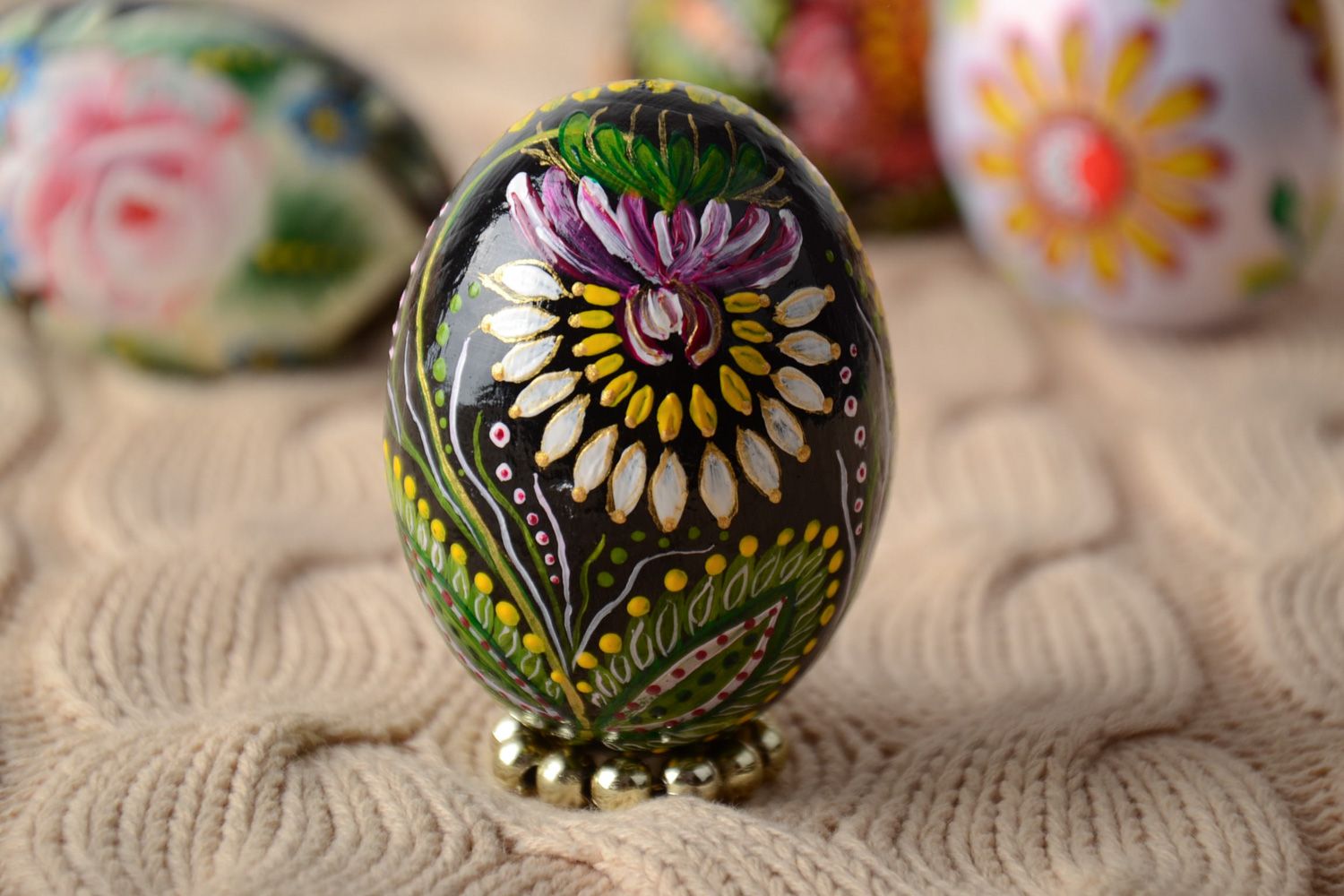 Handmade wooden Easter egg painted with floral ornaments for interior decoration photo 1