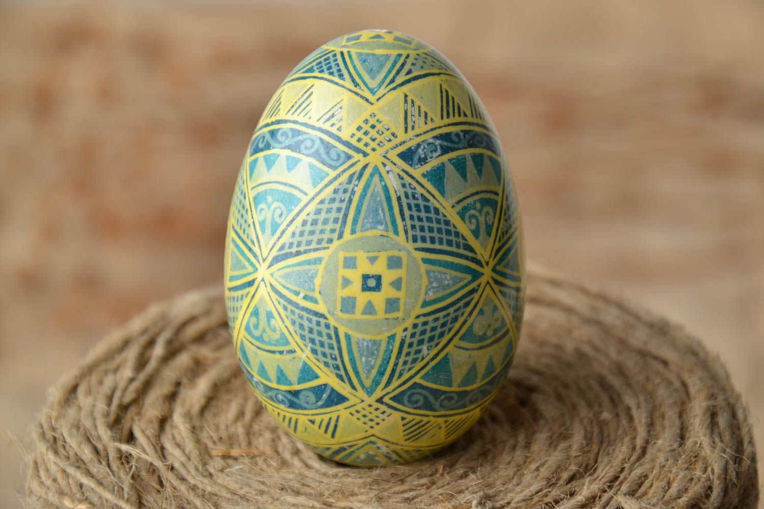 Easter egg with traditional symbolics painted with aniline dyes photo 1