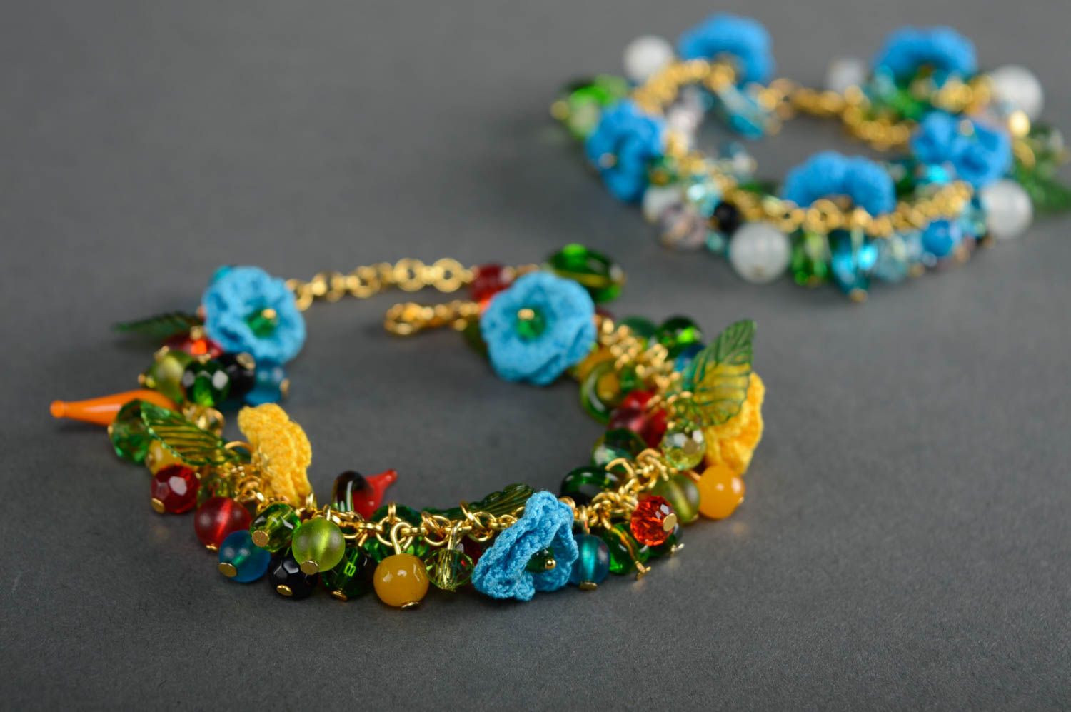 Bright beautiful crochet bracelet with charms and flowers photo 5