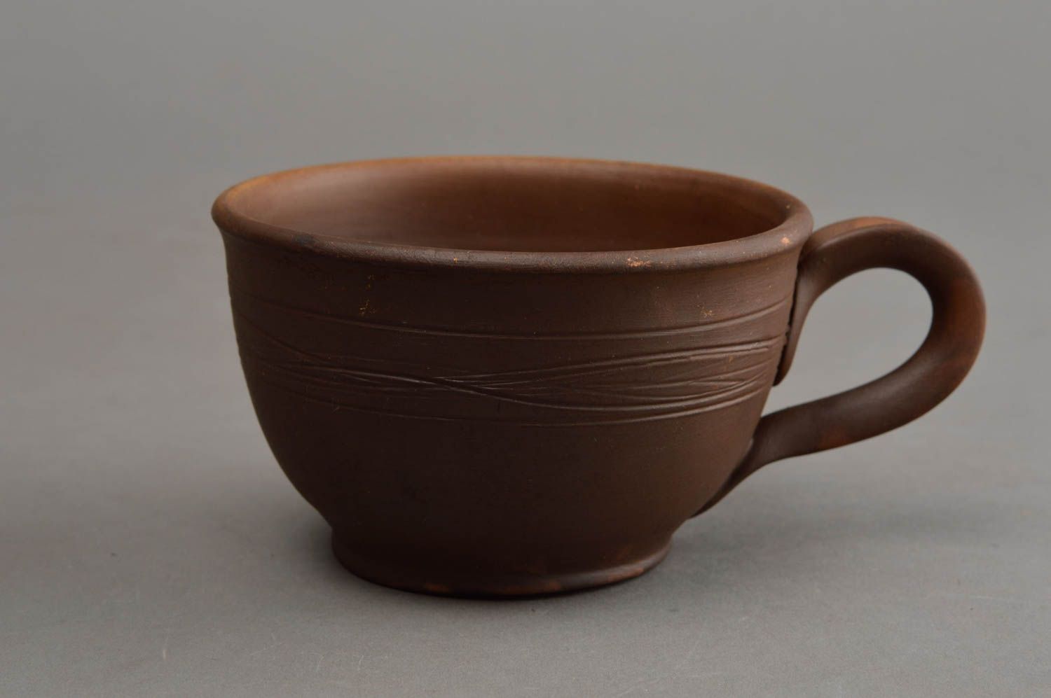Brown wide ceramic wide coffee cup in rustic plain design with handle photo 2