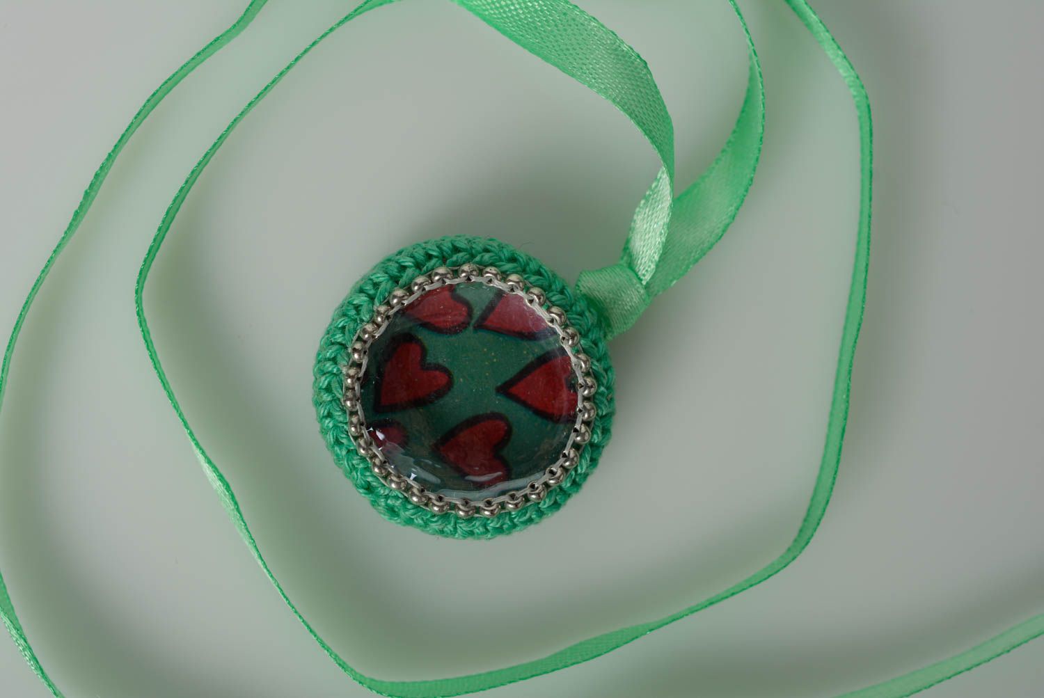 Handmade crochet pendant created of cotton threads and glass button on satin ribbon photo 1