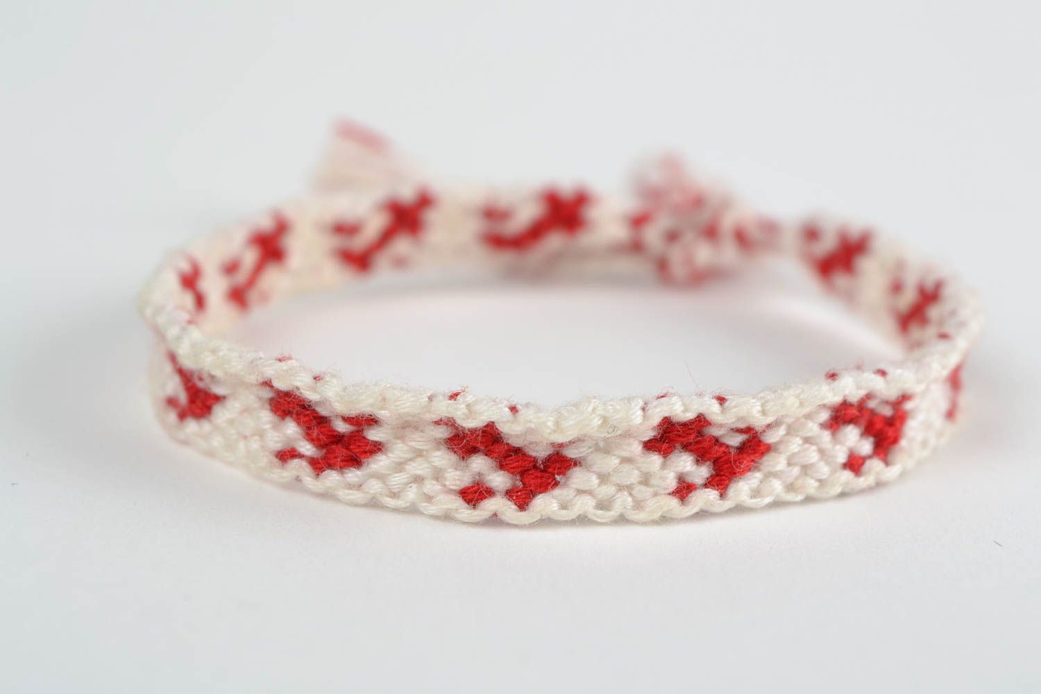 Handmade thin white and red friendship wrist bracelet woven of threads for girls photo 3