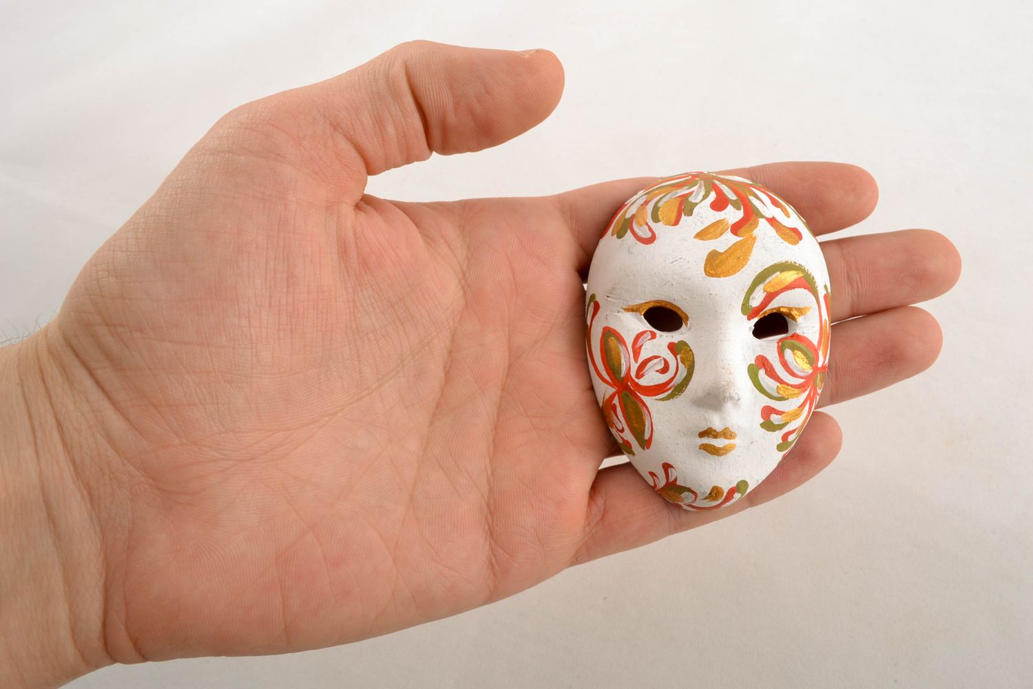Ceramic fridge magnet in the shape of tiny carnival mask photo 1