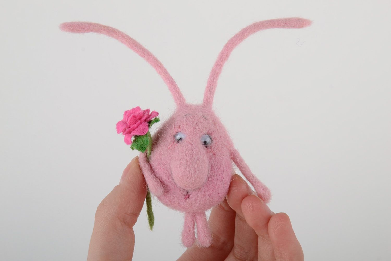 Handmade fridge magnet felted of natural wool touching pink creature with flower photo 5