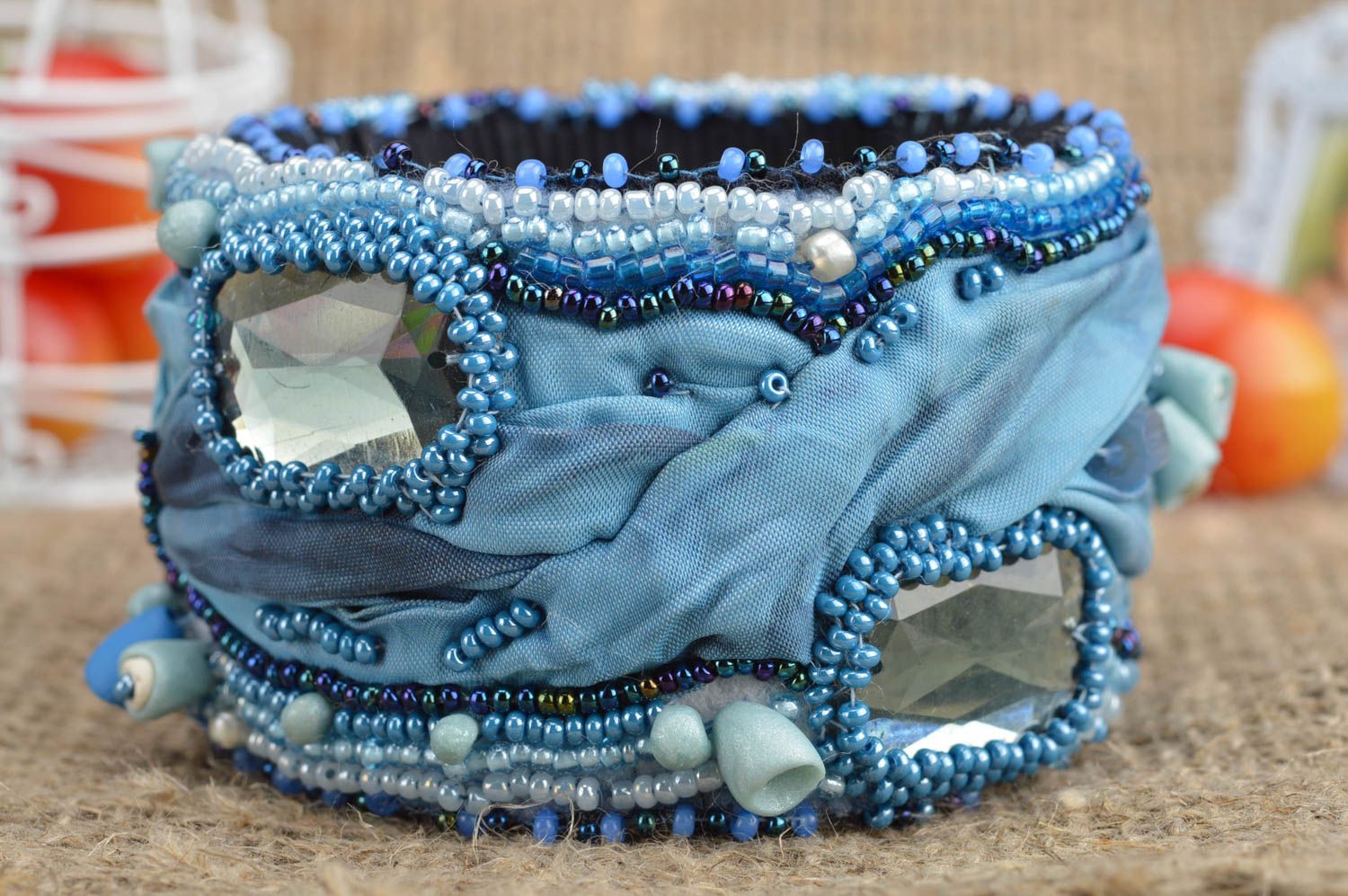 Handcrafted fabric massive handmade bracelet in blue color decorated with beads photo 1