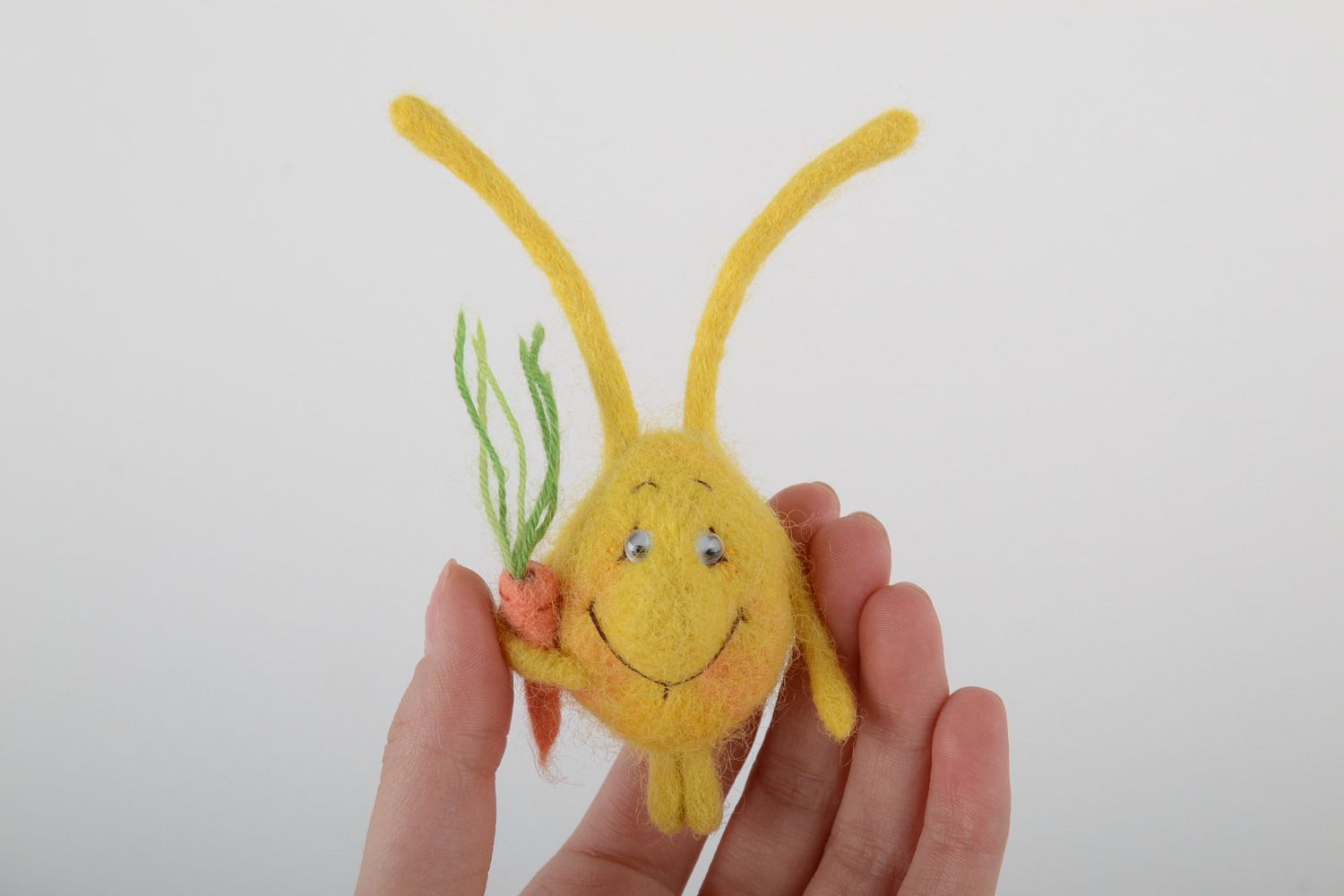 Small handmade brooch felted on natural wool in the shape of cute yellow rabbit photo 4