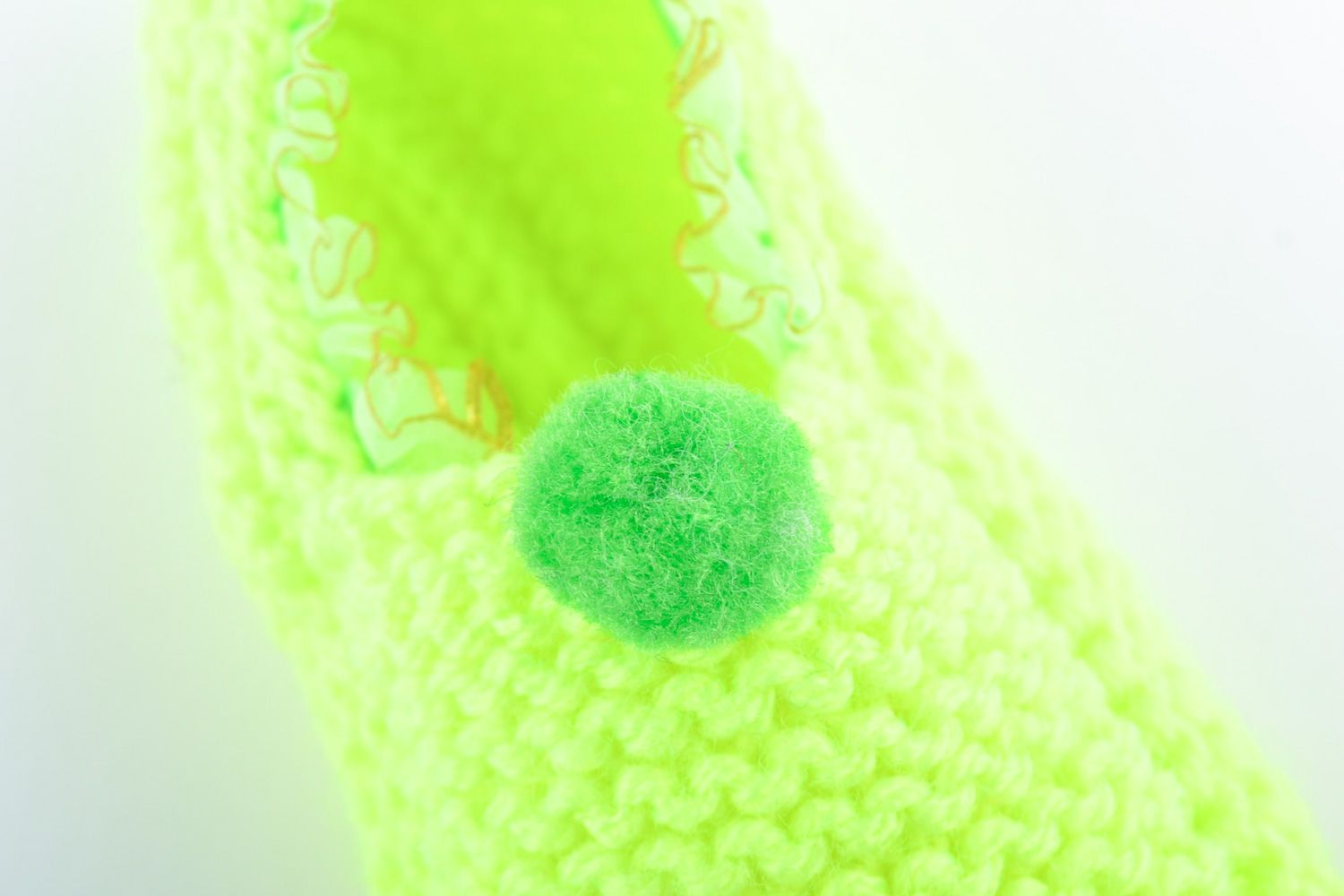 Beautiful light hand knitted wool slippers of lime color photo 3