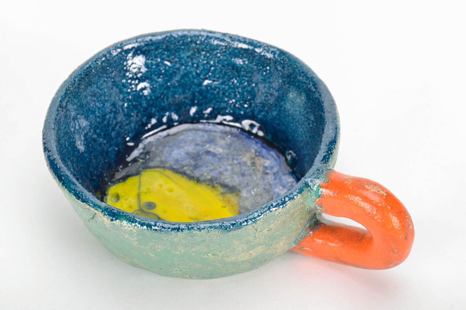 Hand-molded clay glazed green, orange, blue cup with handle photo 3
