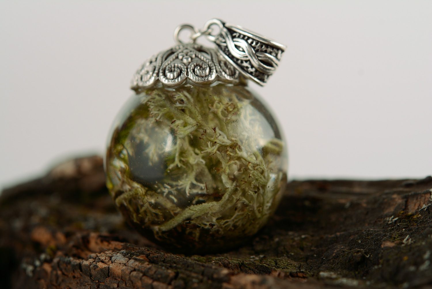 Handmade transparent round neck pendant with moss inside coated with epoxy resin photo 1