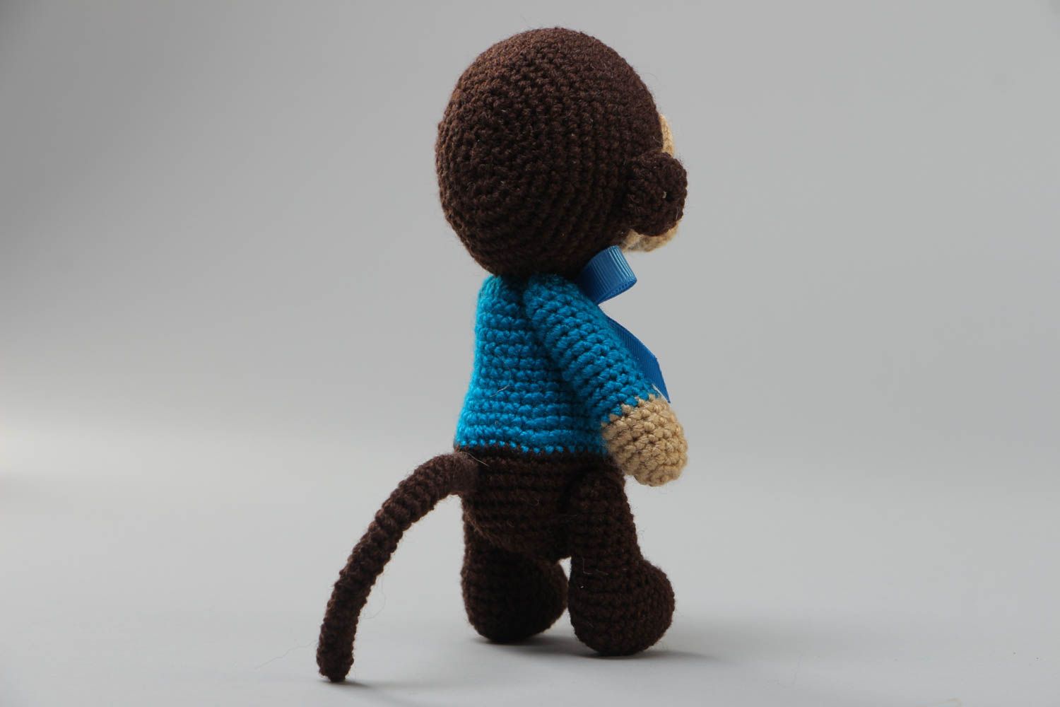 Handmade small crochet soft toy sad monkey in blue sweater with bow photo 4
