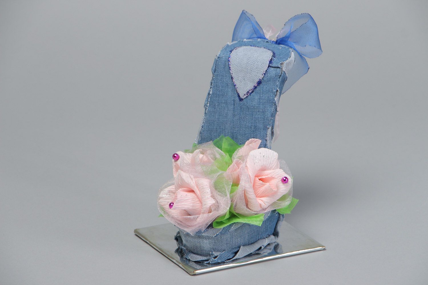 Handmade decorative fabric and paper shoe with flowers on holder floristics ideas photo 2